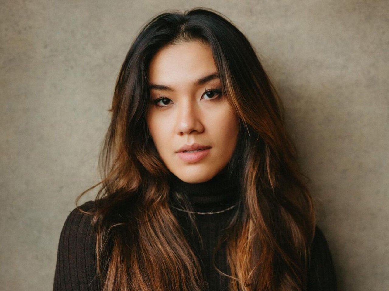 Portrait of Julia Saubier wearing black turtle neck