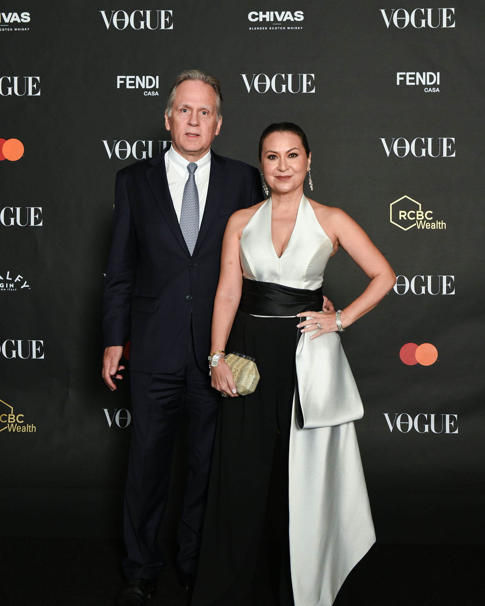 David and Marilu Batchelor posing at the photo wall at the Vogue Philippines Gala 2023