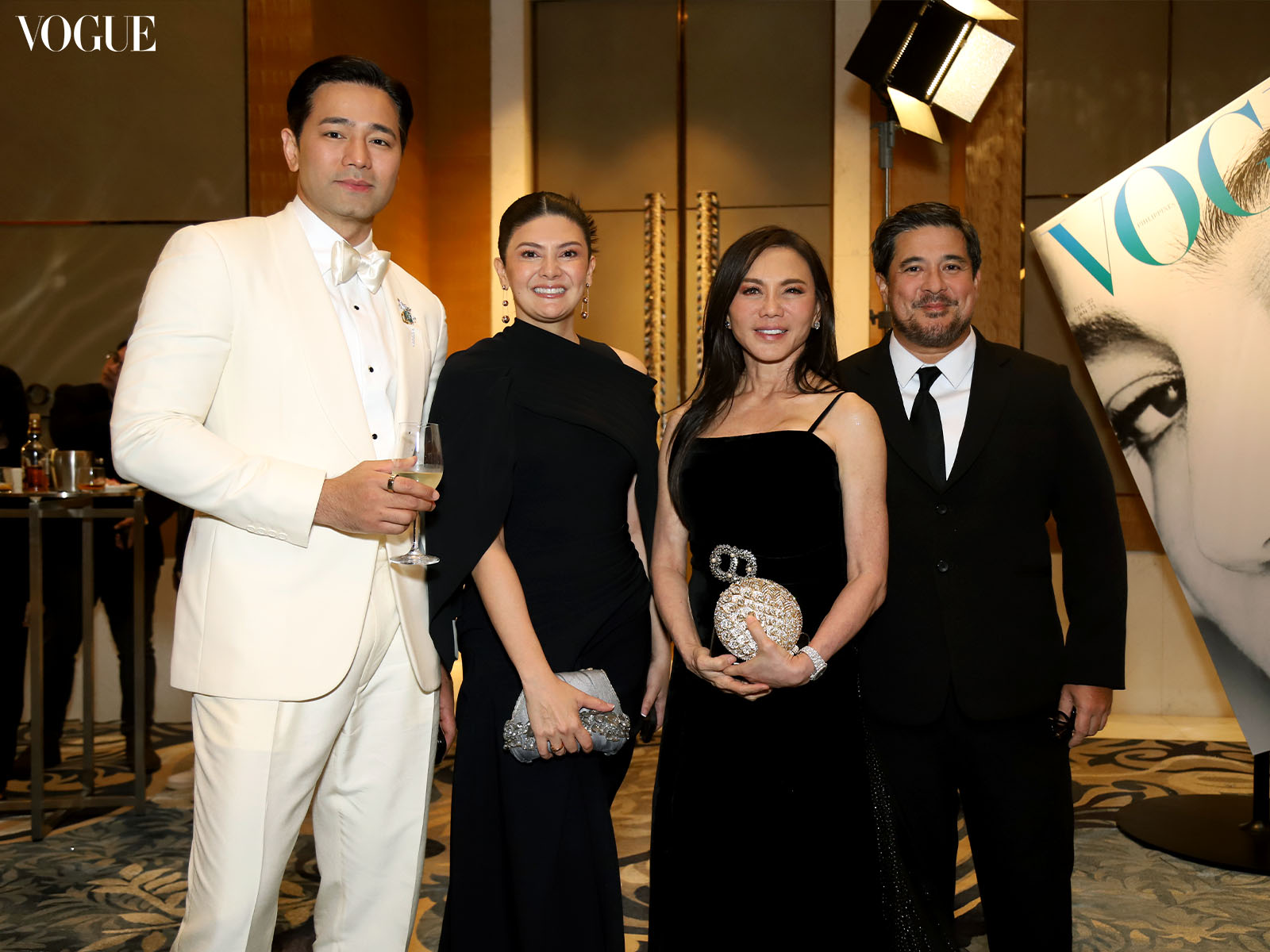 Hayden Kho Charlene Gonzalez Muhlach Vicki Belo and Aga Muhlach posing at the photo wall at the Vogue Philippines Gala 2023