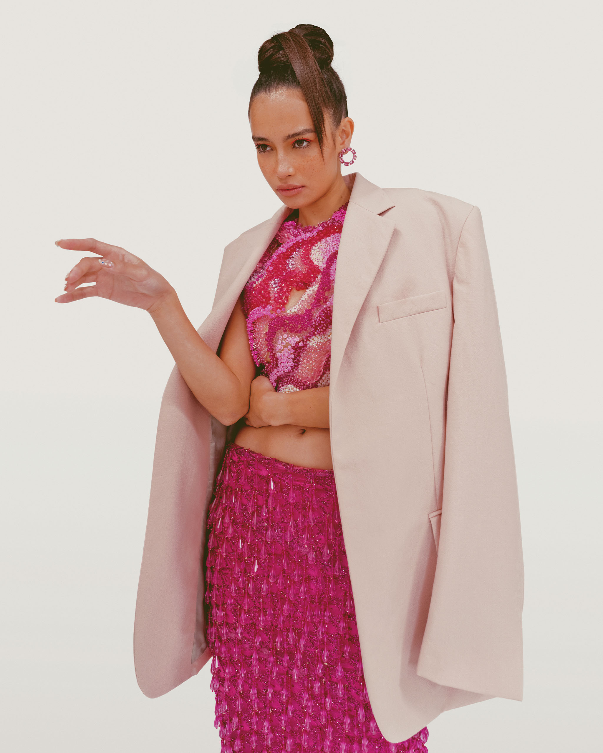 Kelsey Merritt wearing a pink oversized jacket blazer