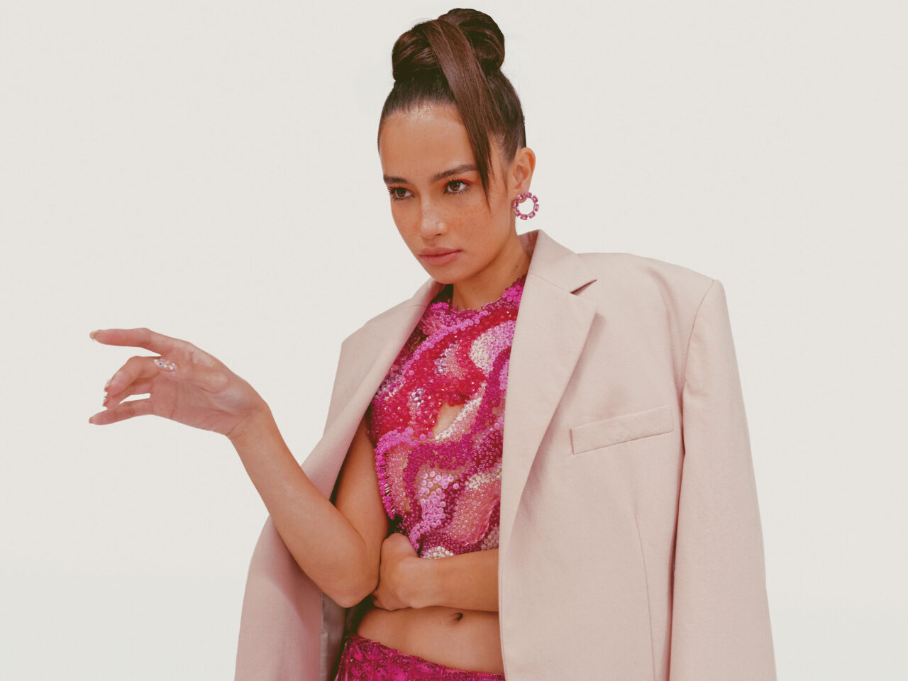 Kelsey Merritt wearing a pink oversized jacket blazer