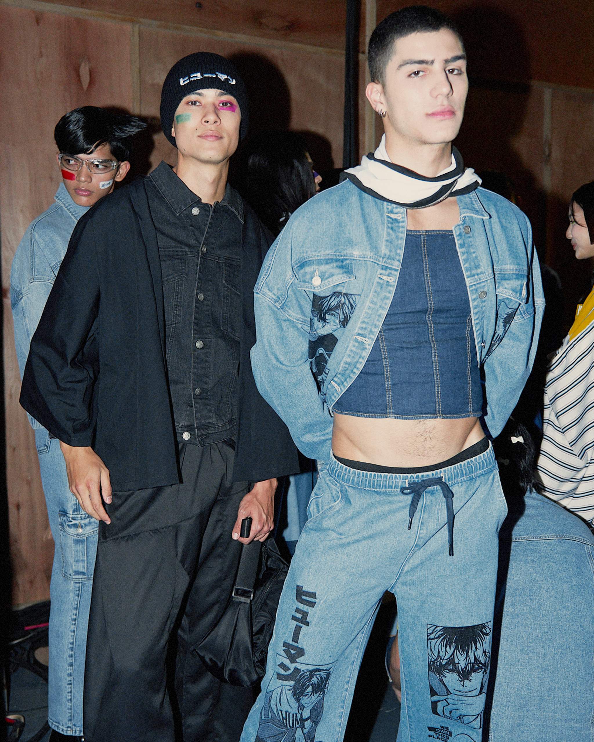 Denim on denim outfit for men. Denim jacket on top of a denim corset.