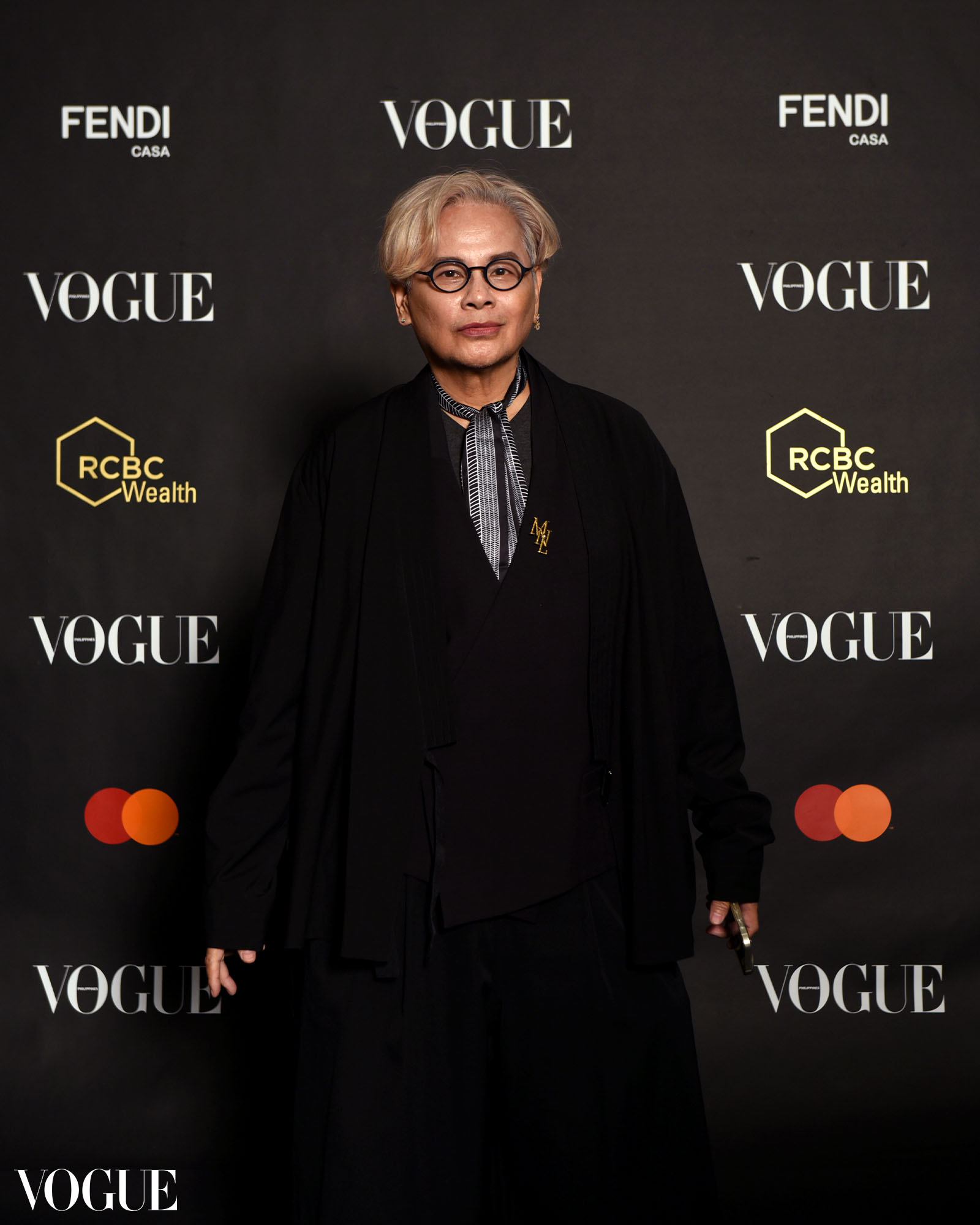 Henri Calayag posing at the photo wall at the Vogue Philippines Gala 2023