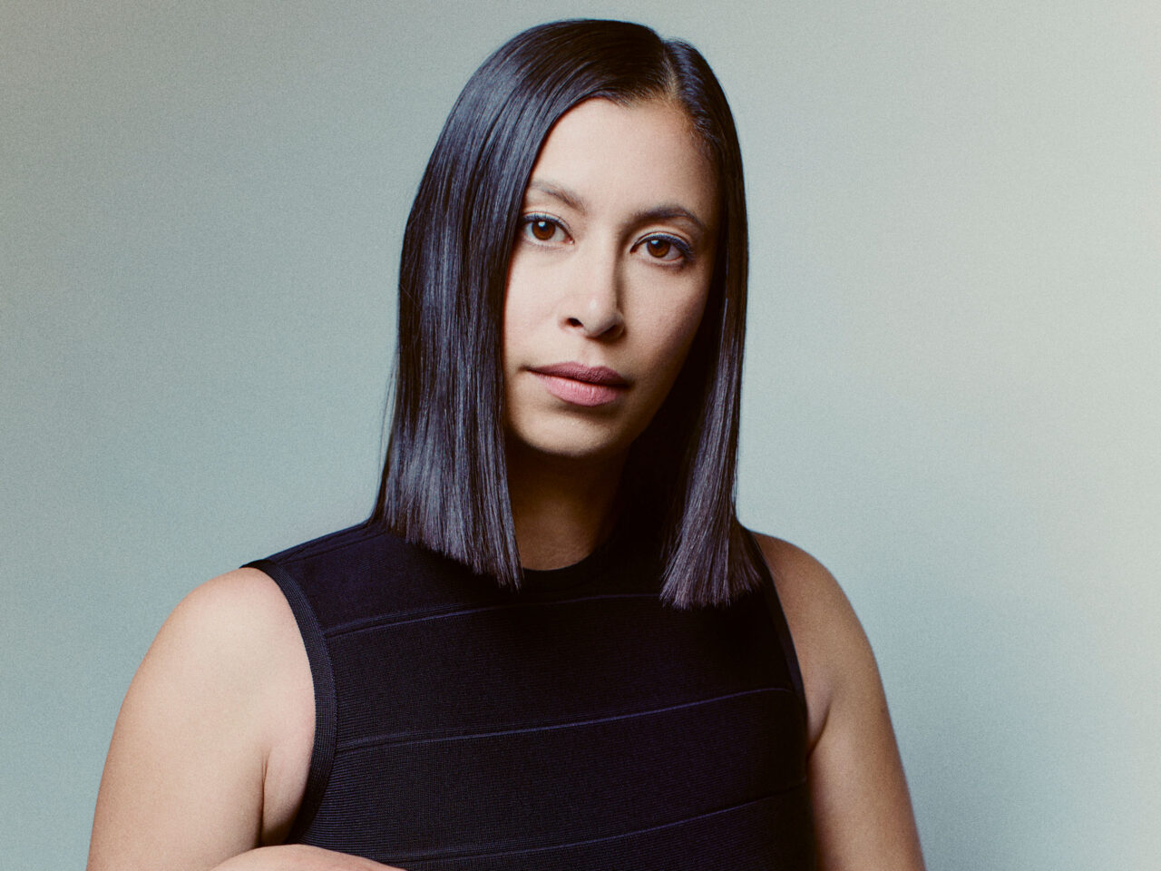 Michelle Ochs studio portrait against gray simple background