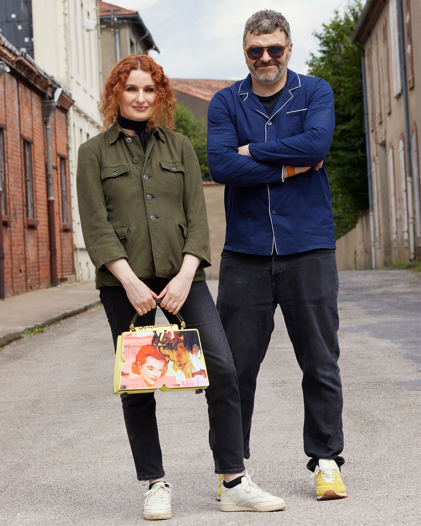 Artists Tursic & Mille posing with their Artycapucines.