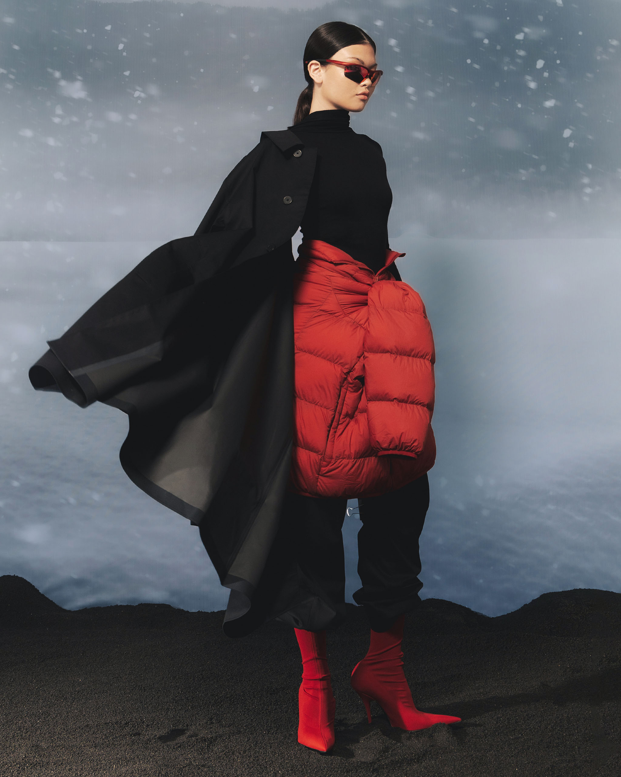 A woman modeling with sunglasses