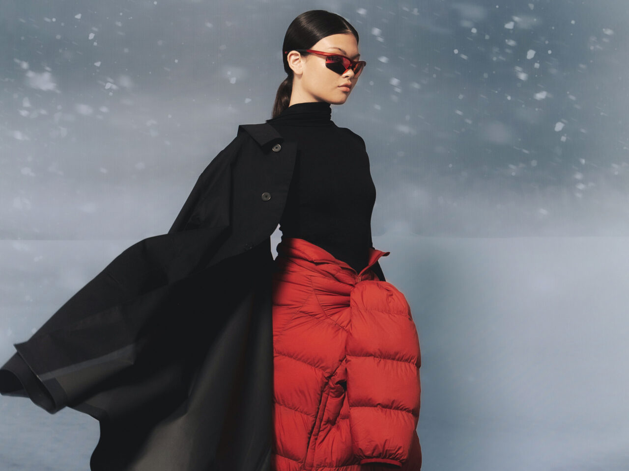 A woman modeling with sunglasses