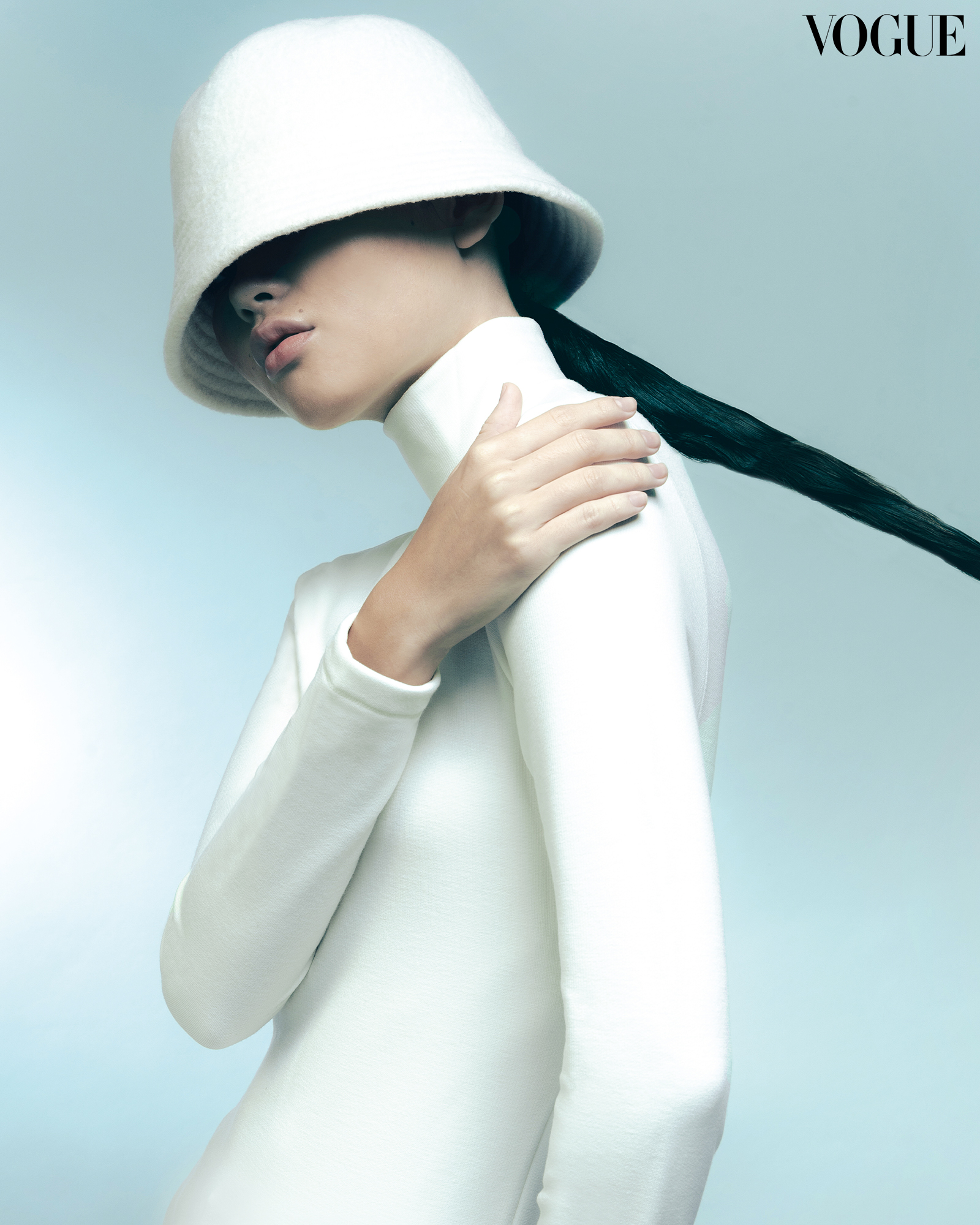 A woman modeling with a bucket hat