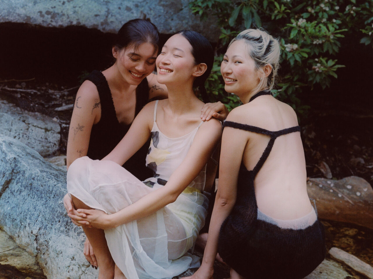 Diana Carl, Jiwon Ra and Megan Rodrigues sitting down and smiling