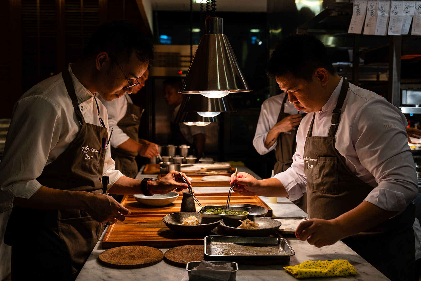 Chefs preparing dishes in the Gallery kitchen.