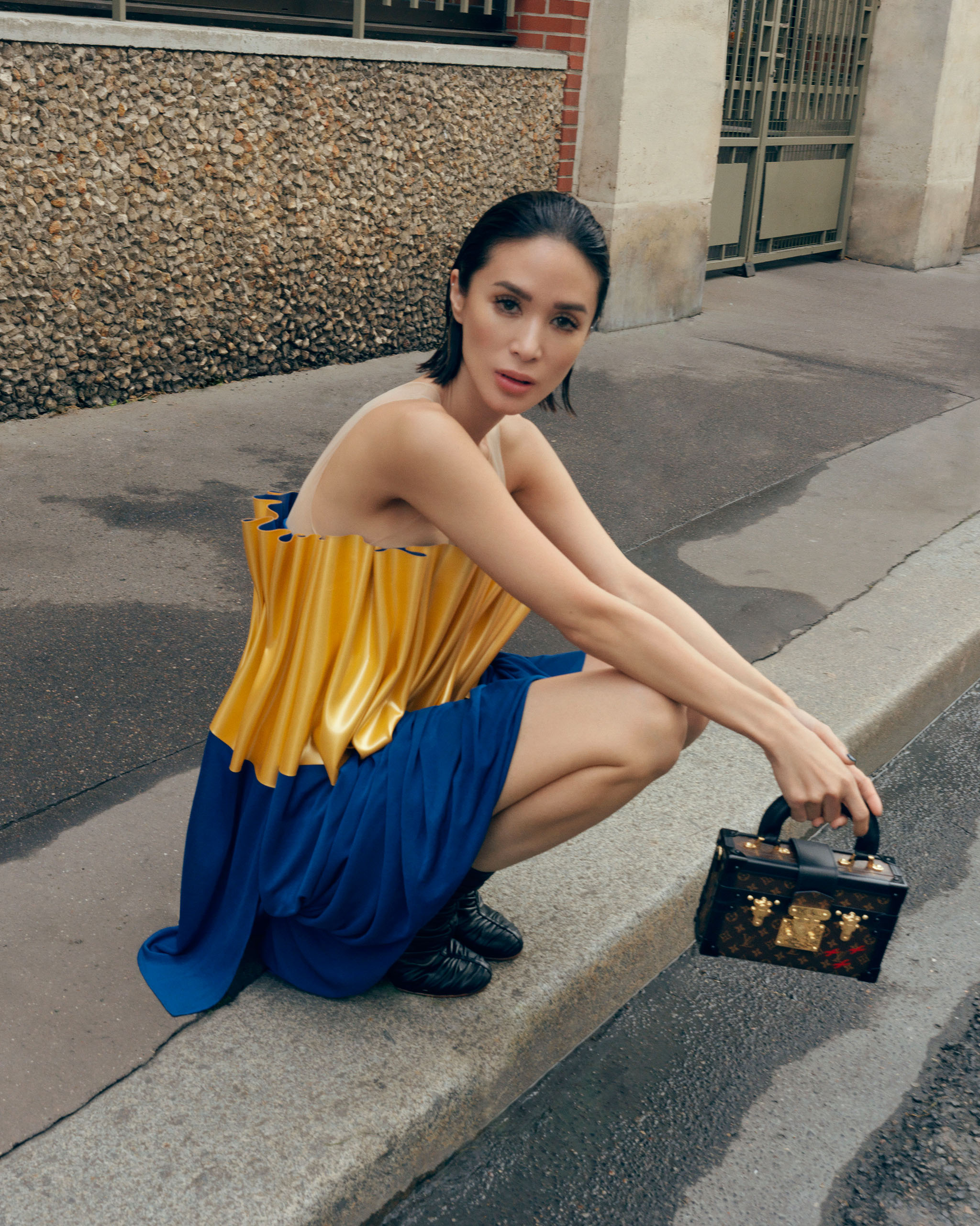 Heart Evangelista wearing a Louis Vuitton two-tone draped top and Petite Malle Capitale.