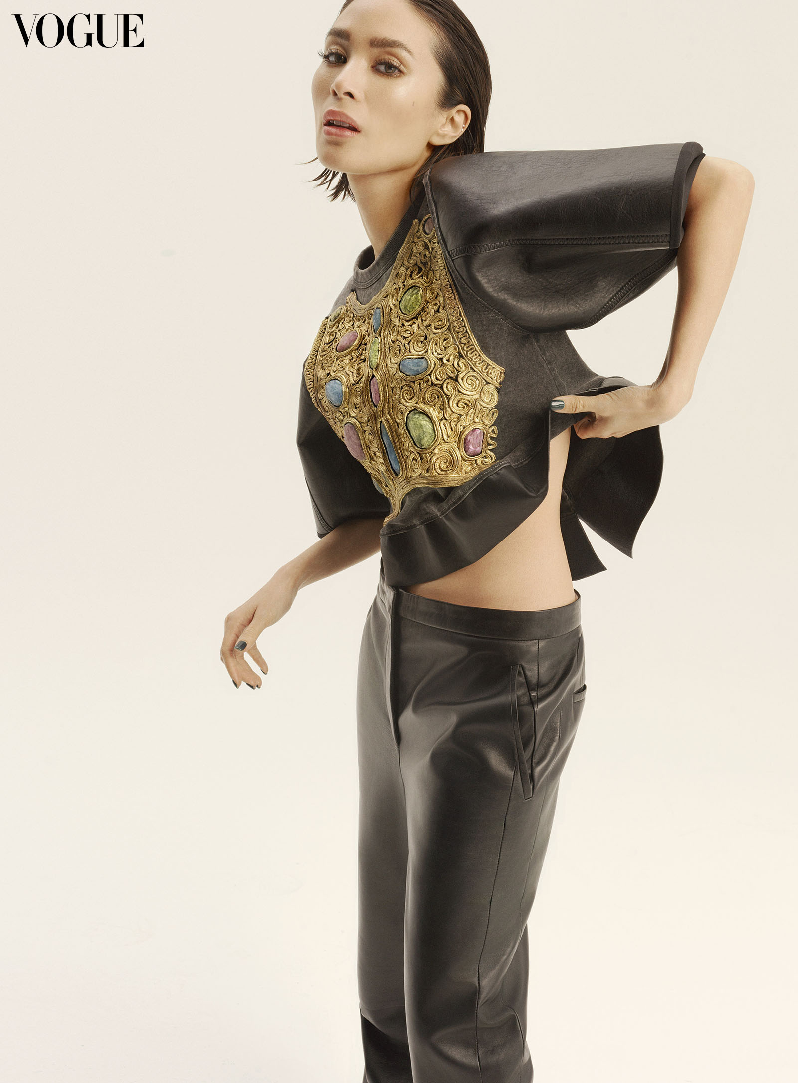 Heart Evangelista wearing a Louis Vuitton swatch print button-up top and leather trousers.