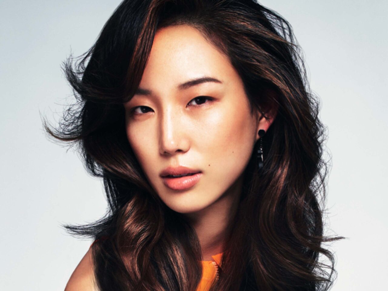 Woman with long curly and wavy hair by TONI&GUY