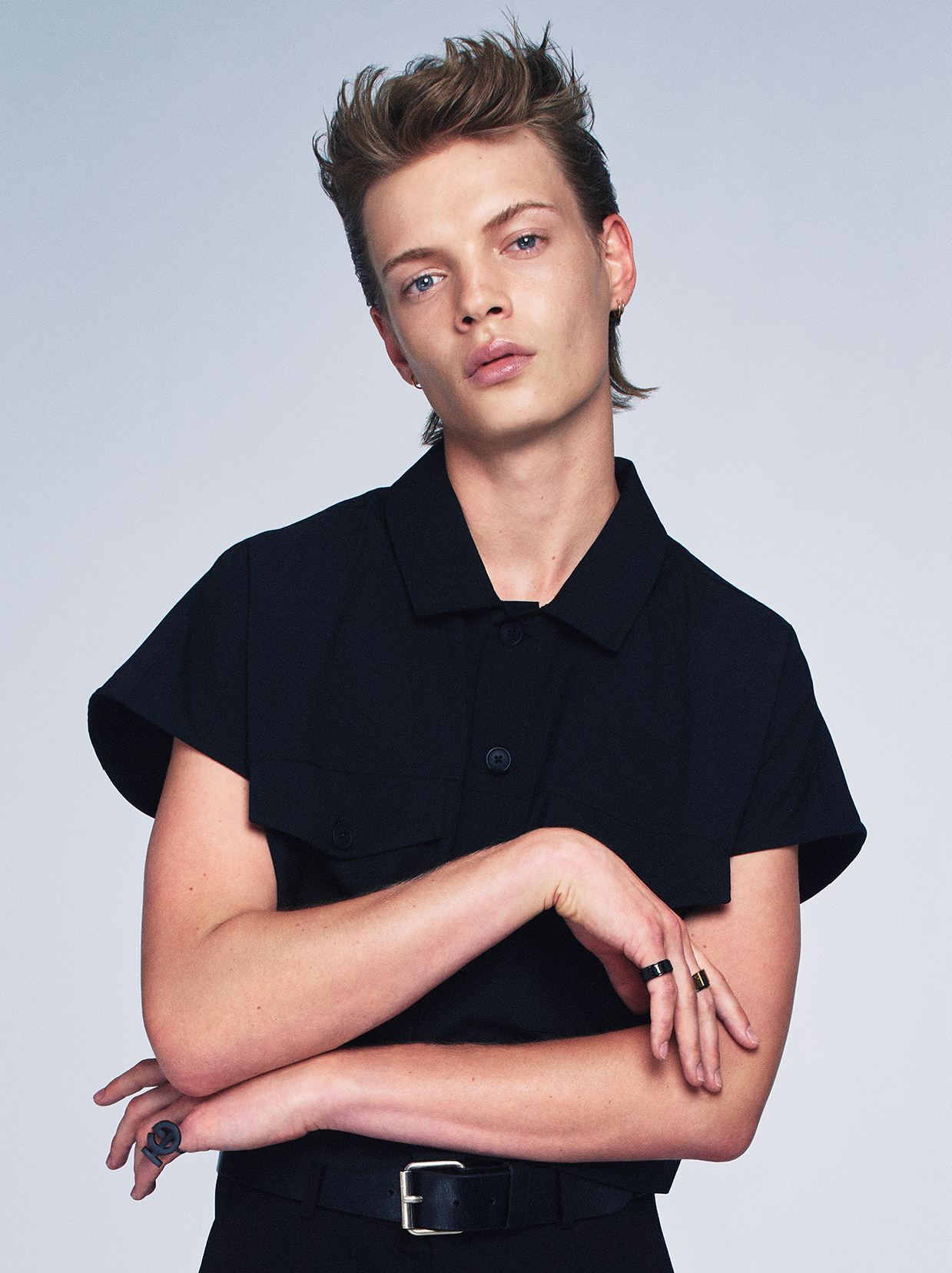 Man wearing black shirt and styled hair by TONI&GUY