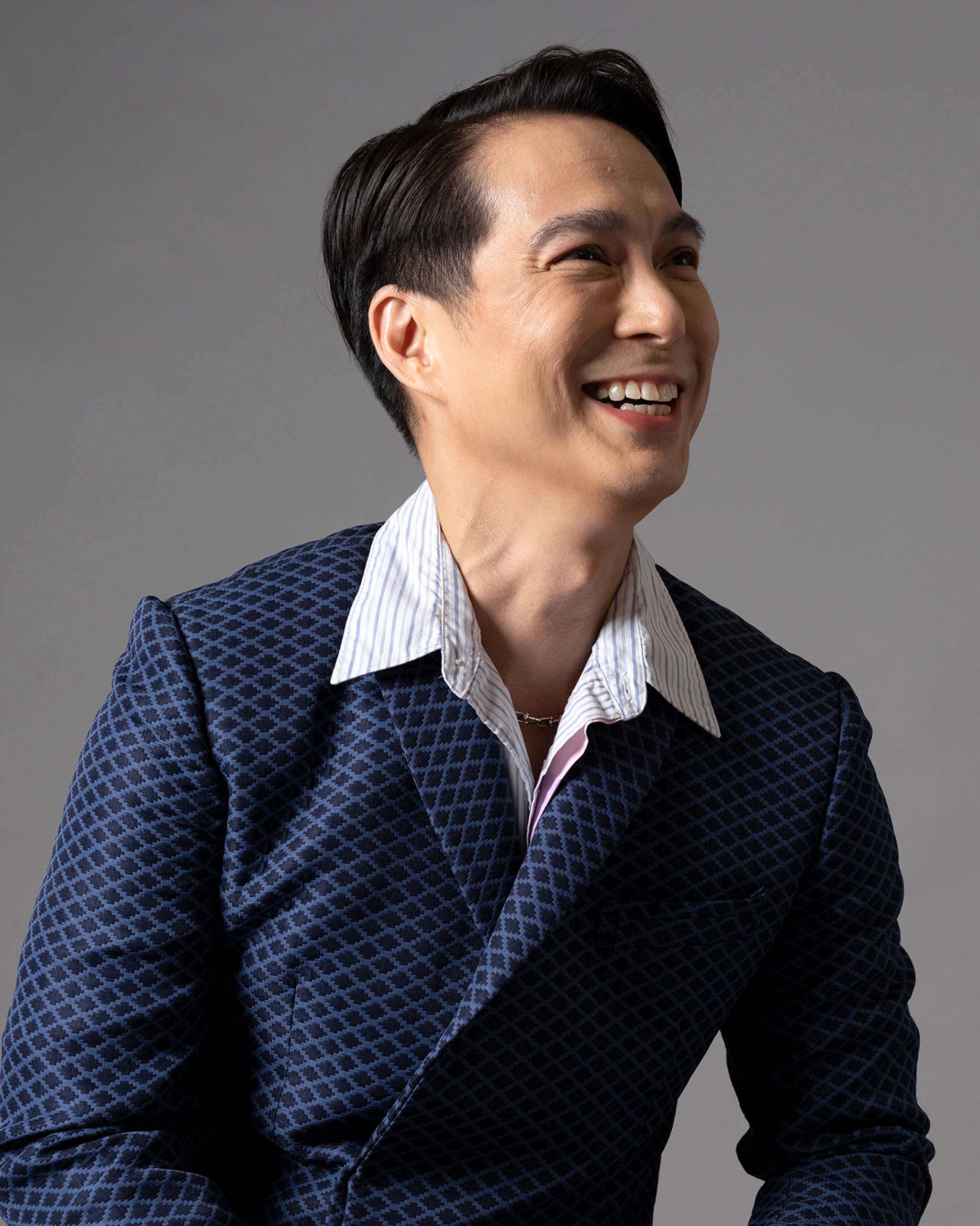 Francis Libiran wearing a navy blue pattern suit