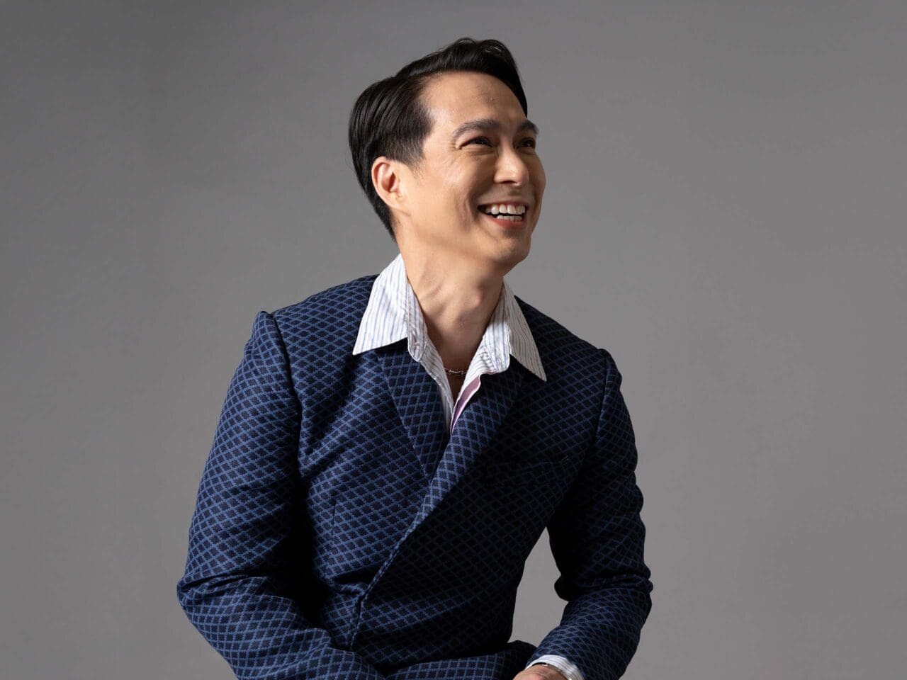 Francis Libiran wearing a navy blue pattern suit