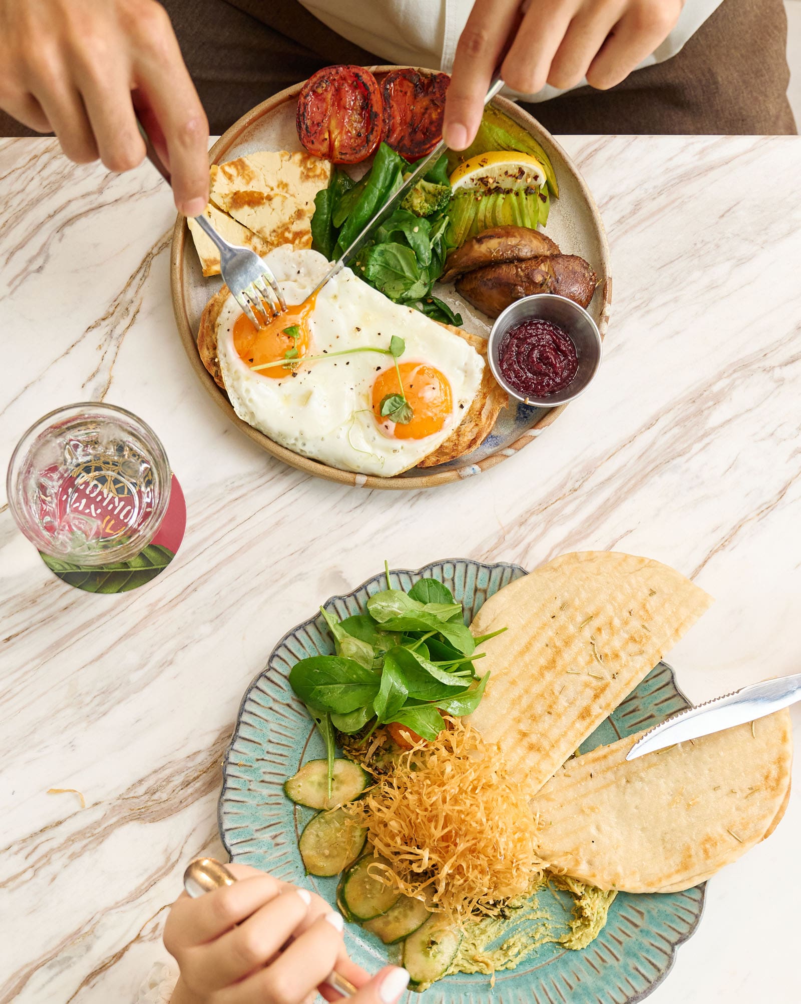 A guest eating the Common Man Full Breakfast