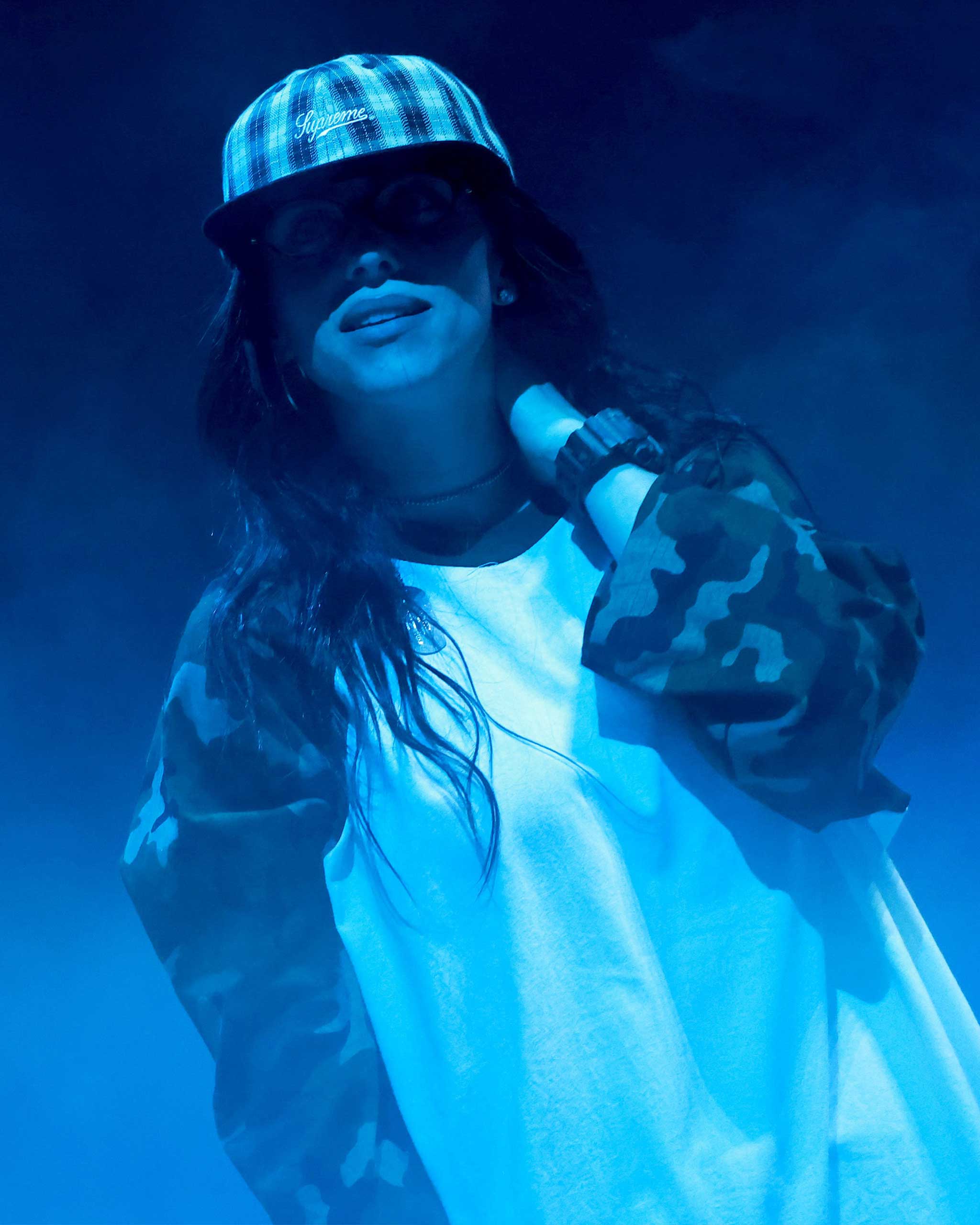 Billie Eilish in a cap and camouflage longsleeves at the Hit Me Hard And Soft listening party