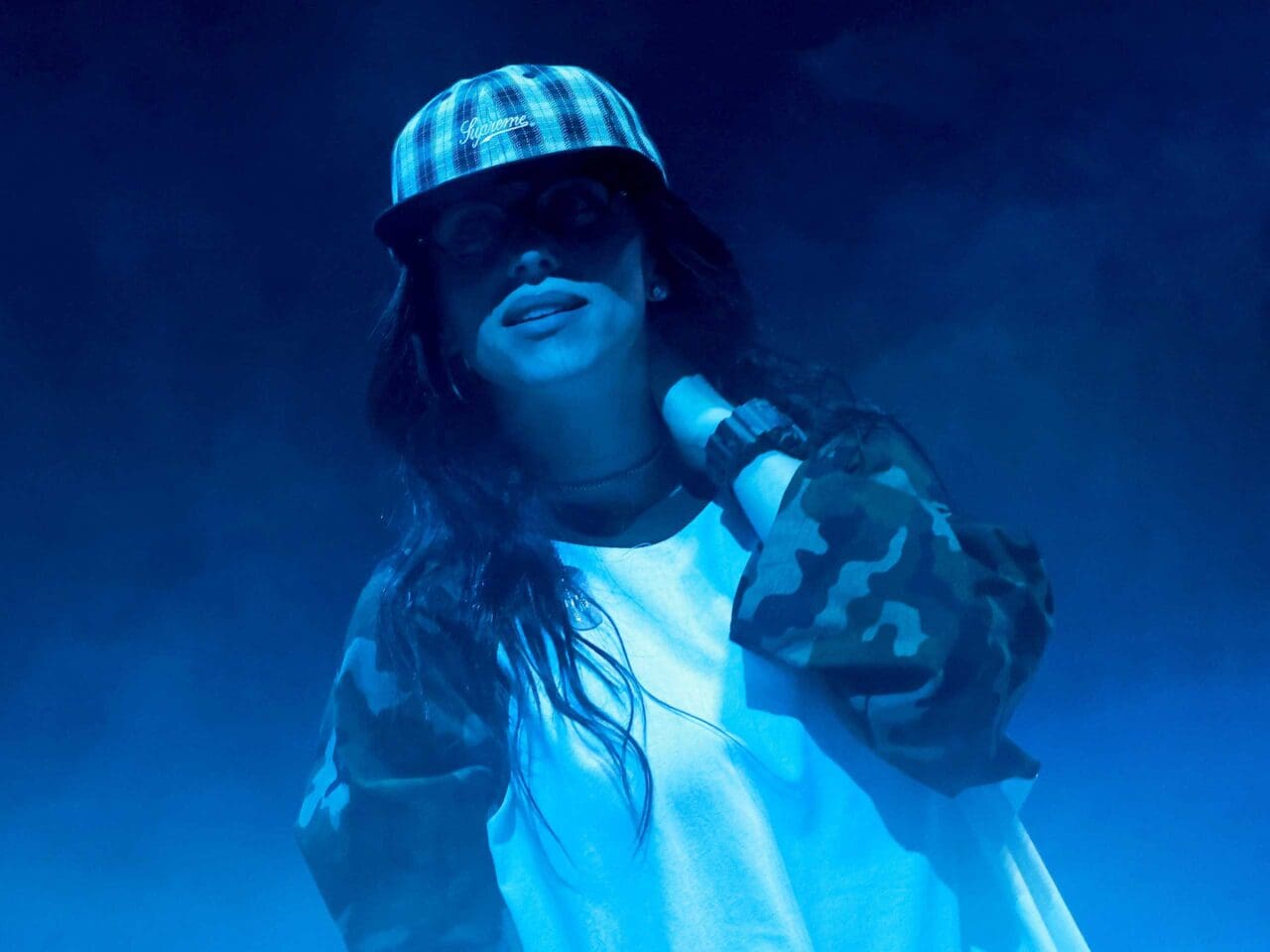 Billie Eilish in a cap and camouflage longsleeves at the Hit Me Hard And Soft listening party