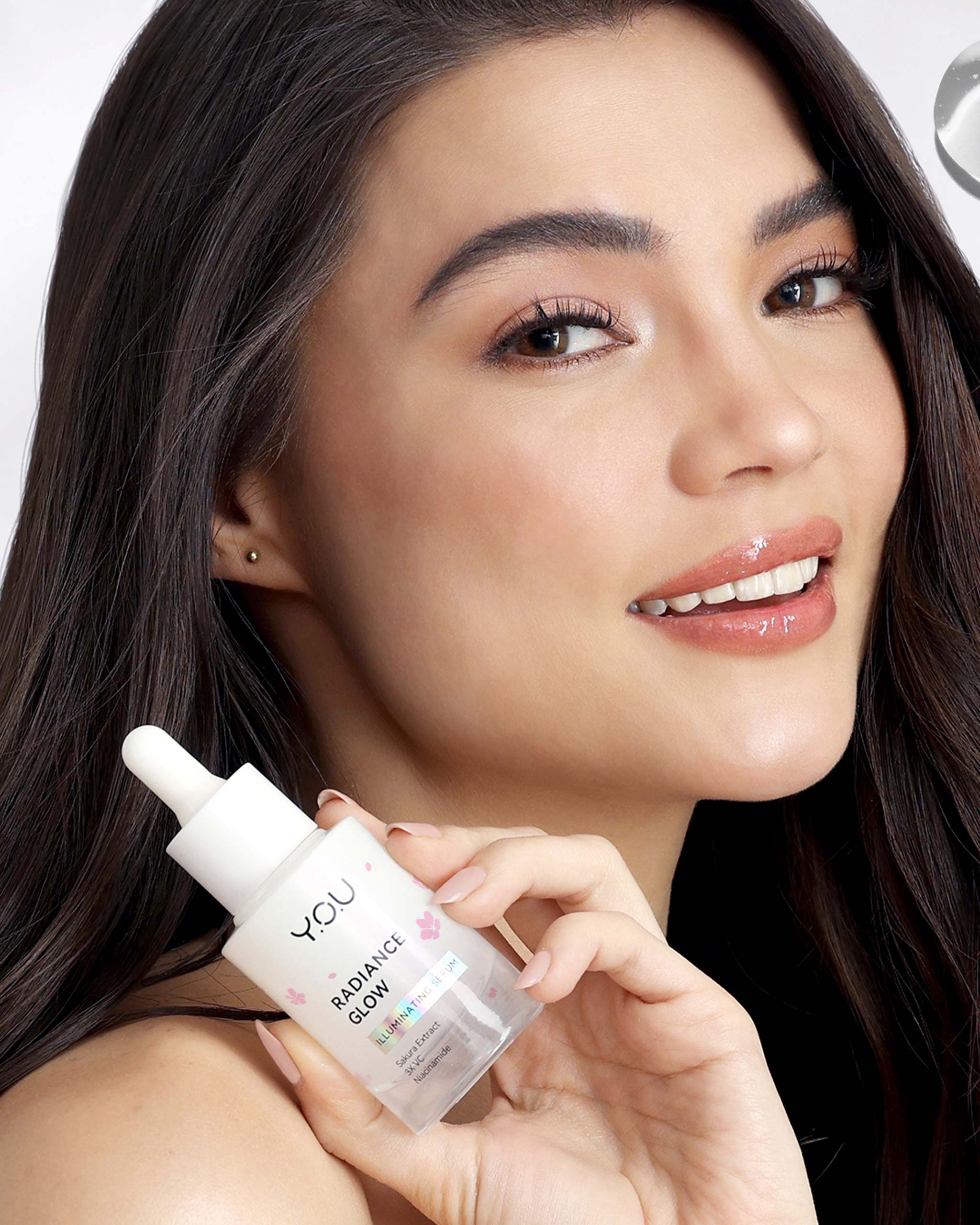 Rhian Ramos holding the YOU BEAUTY Radiance Glow Illuminating Serum