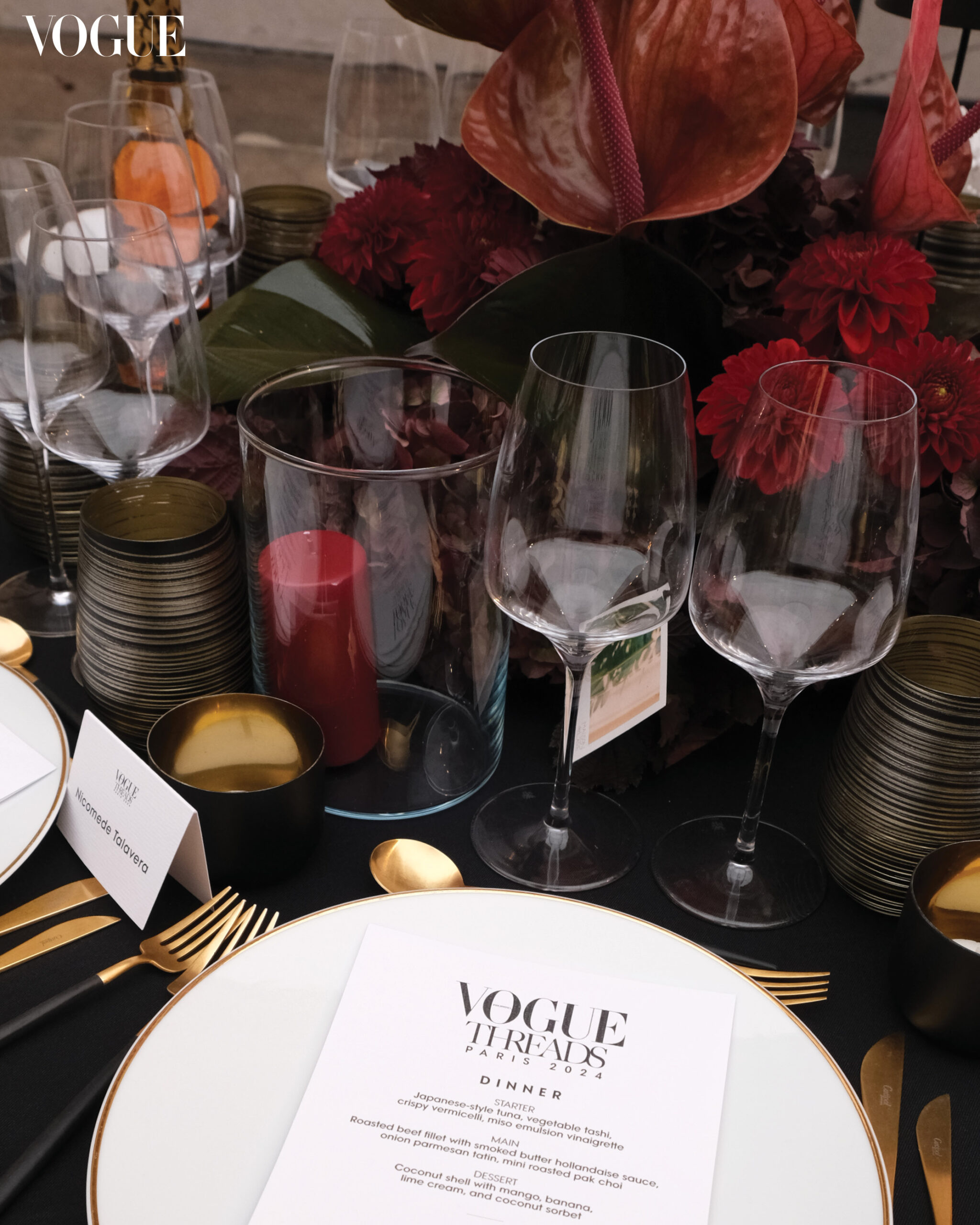 Draped in black with a red floral centerpiece, the tablescape at Vogue Threads also featured scents from Maison de L'Asie.