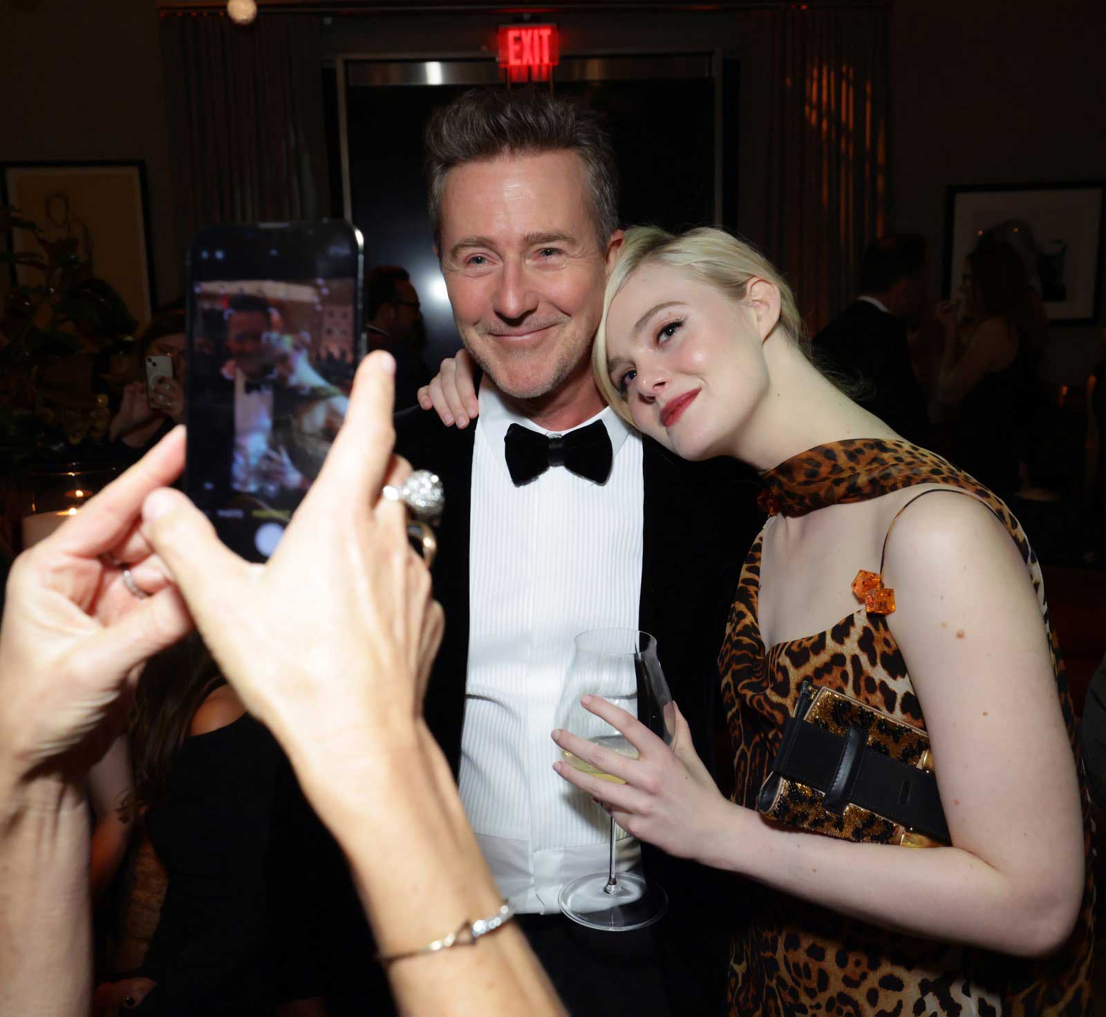 A photo of actors Edward Norton and Elle Fanning.