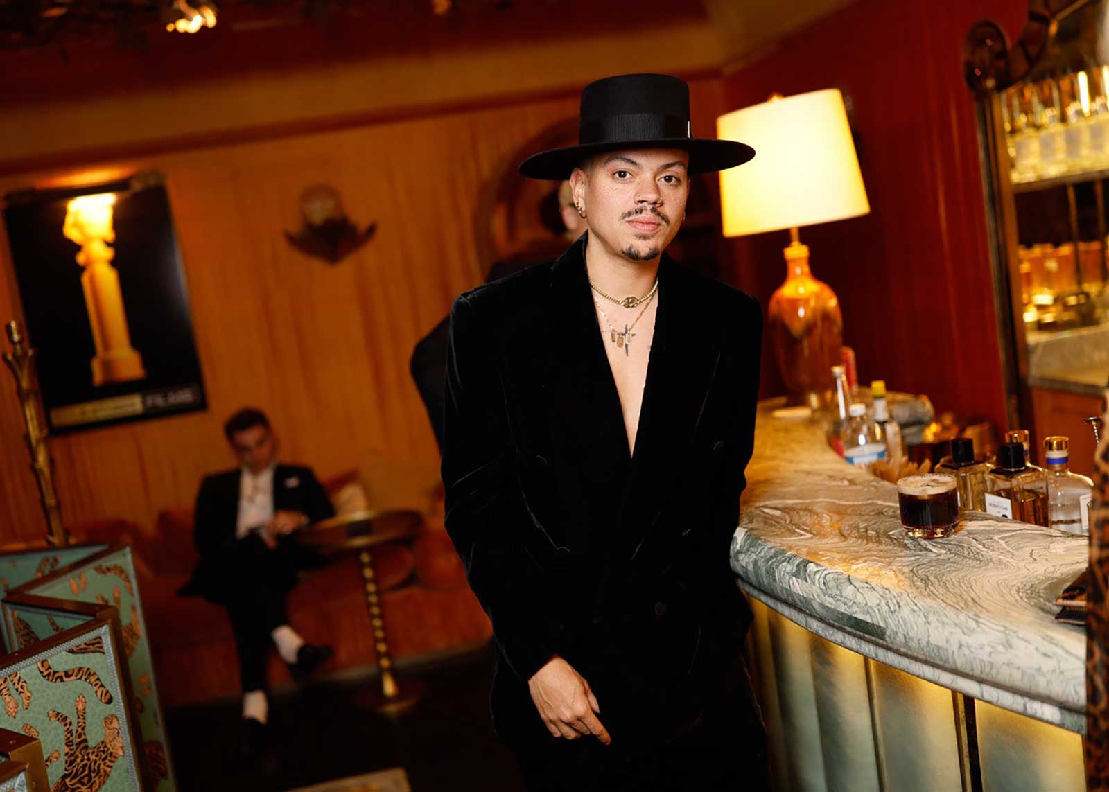 A photo of Evan Ross at the bar at a Golden Globes afterparty.