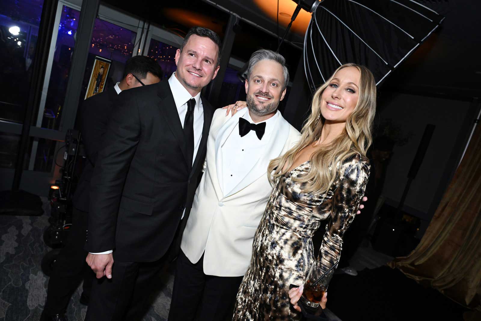 A photo of Nate Bargatze, Nikki Glase, and Gilbert Flores.