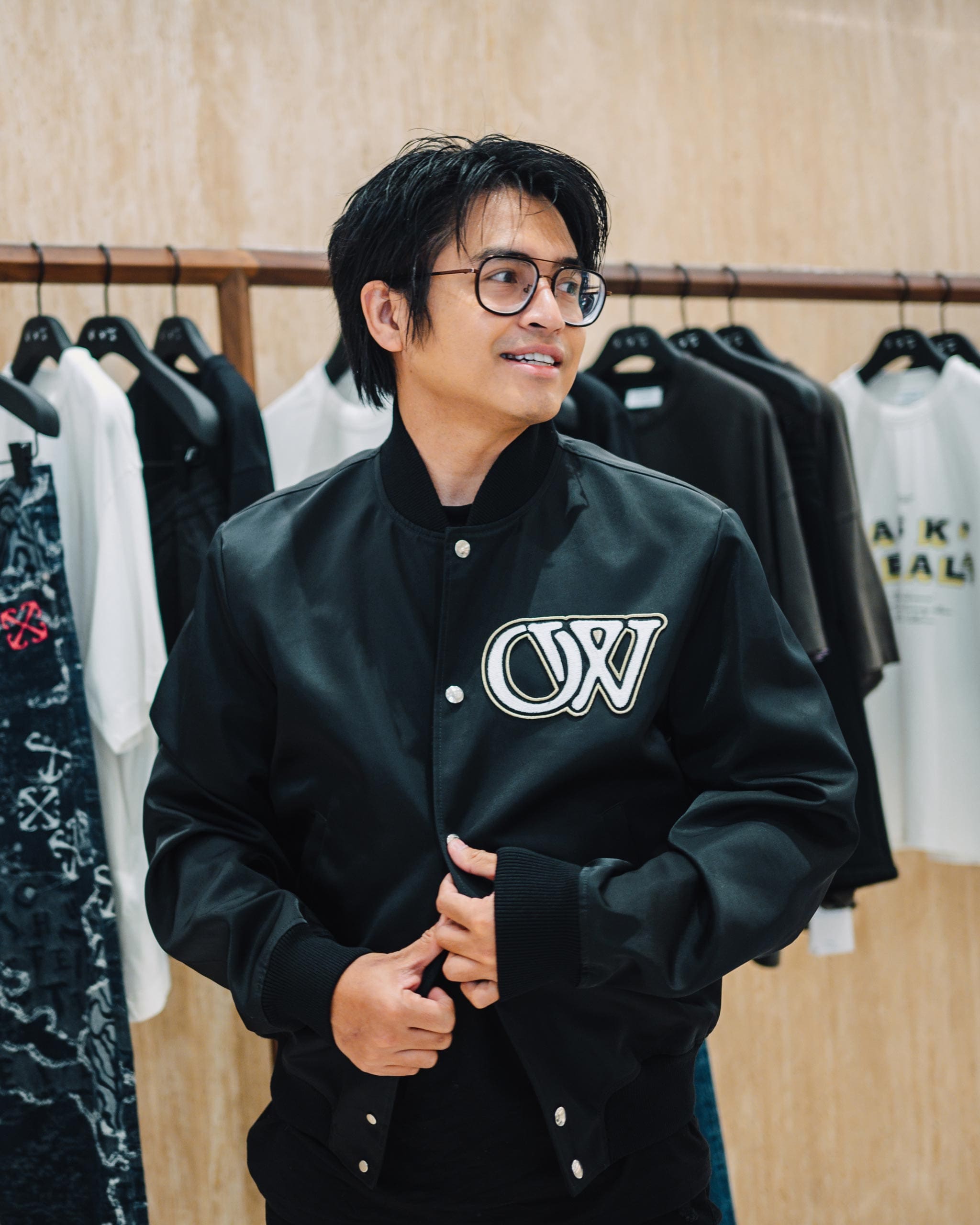Danyl Geneciran wearing the Off-White OW Varsity Jacket in black.
