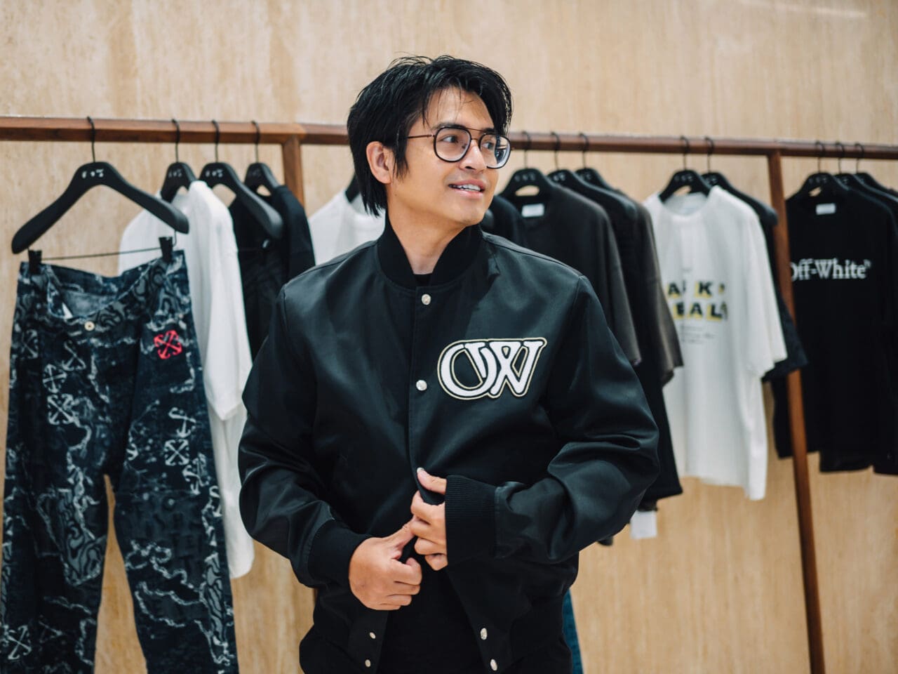 Danyl Geneciran wearing the Off-White OW Varsity Jacket in black.