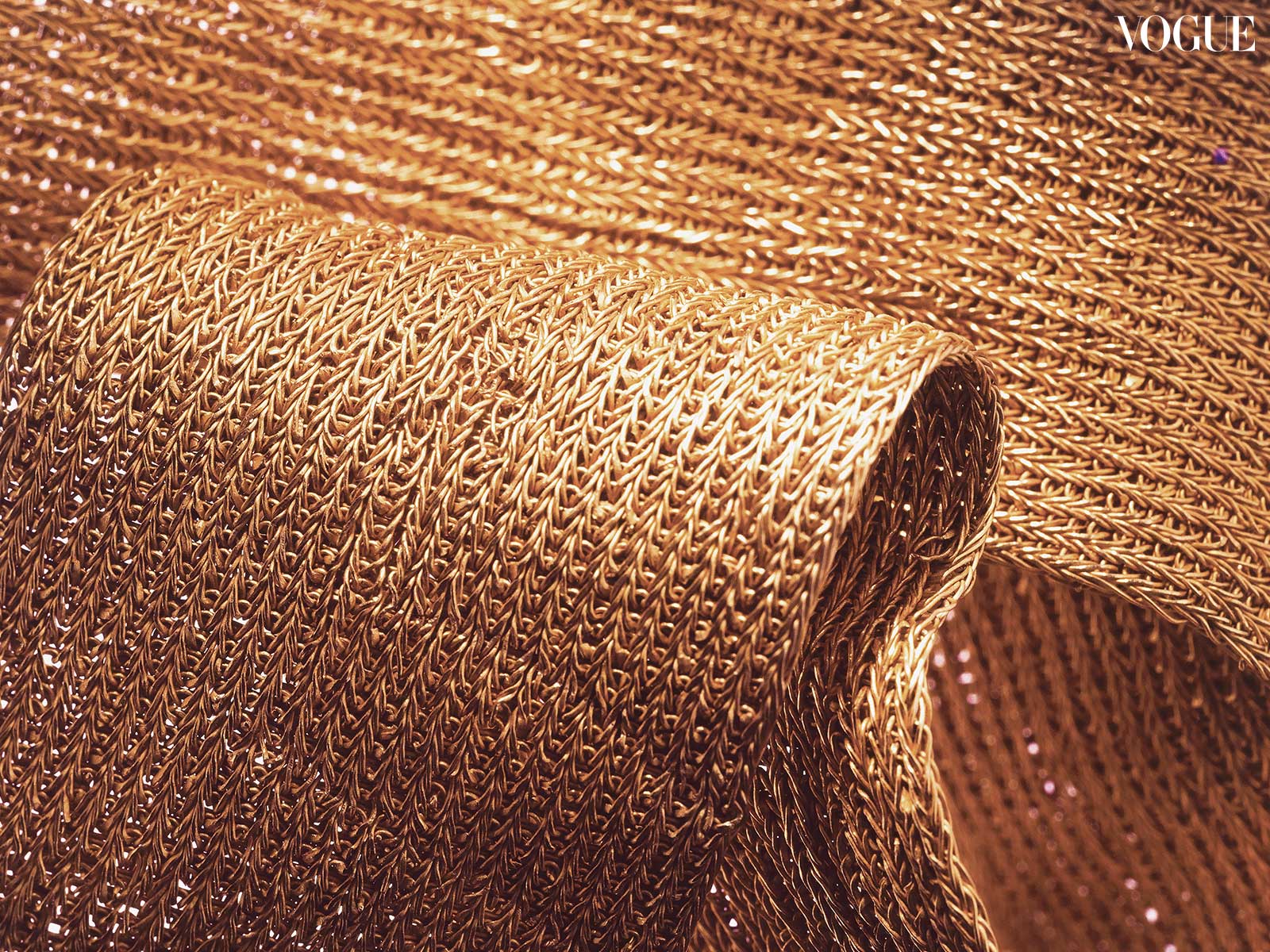 Closeup photo of woven gold.
