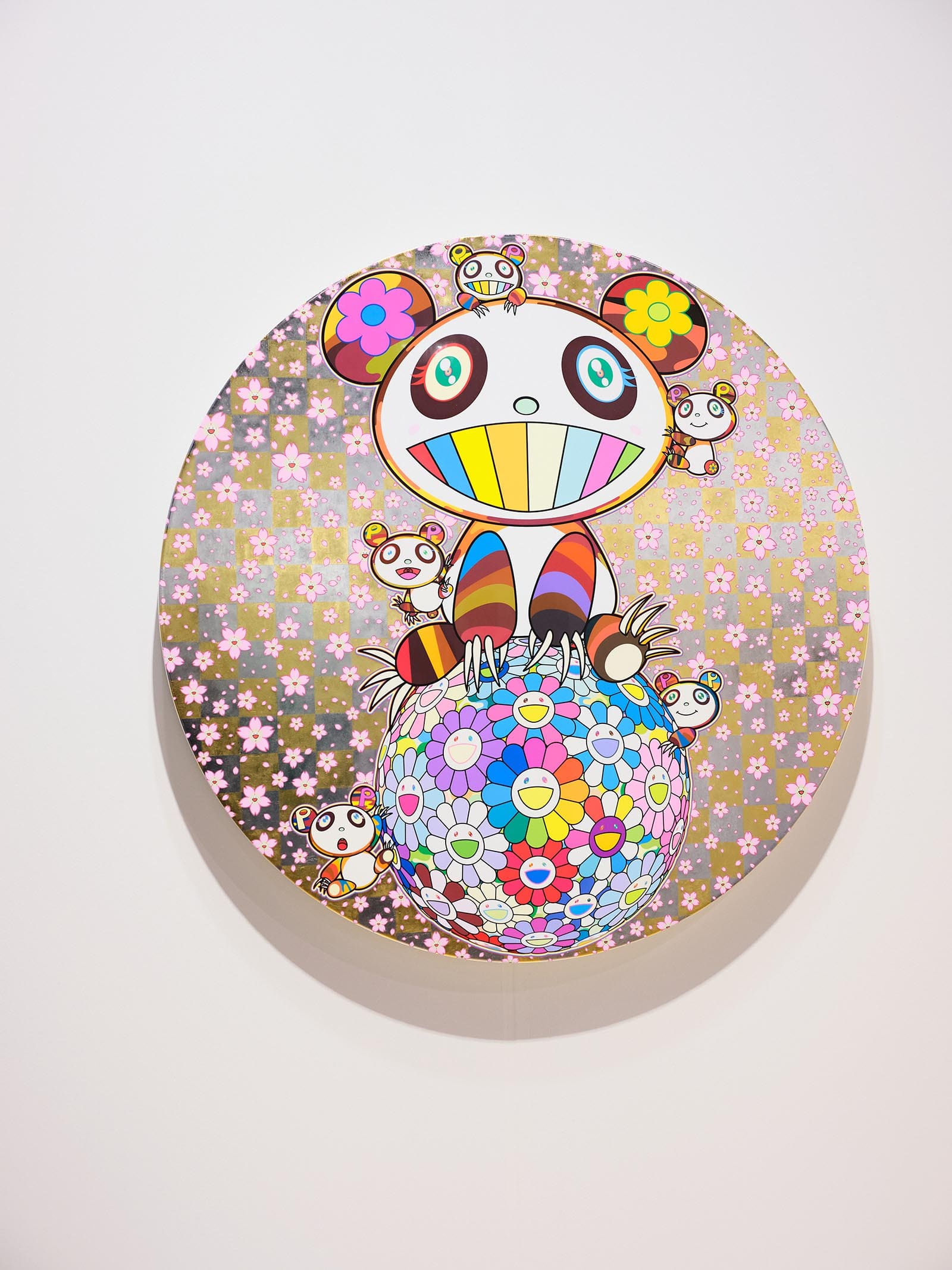 Takashi Murakami artwork on a circular canvas with multiple cartoon pandas and signature cherry blossoms.