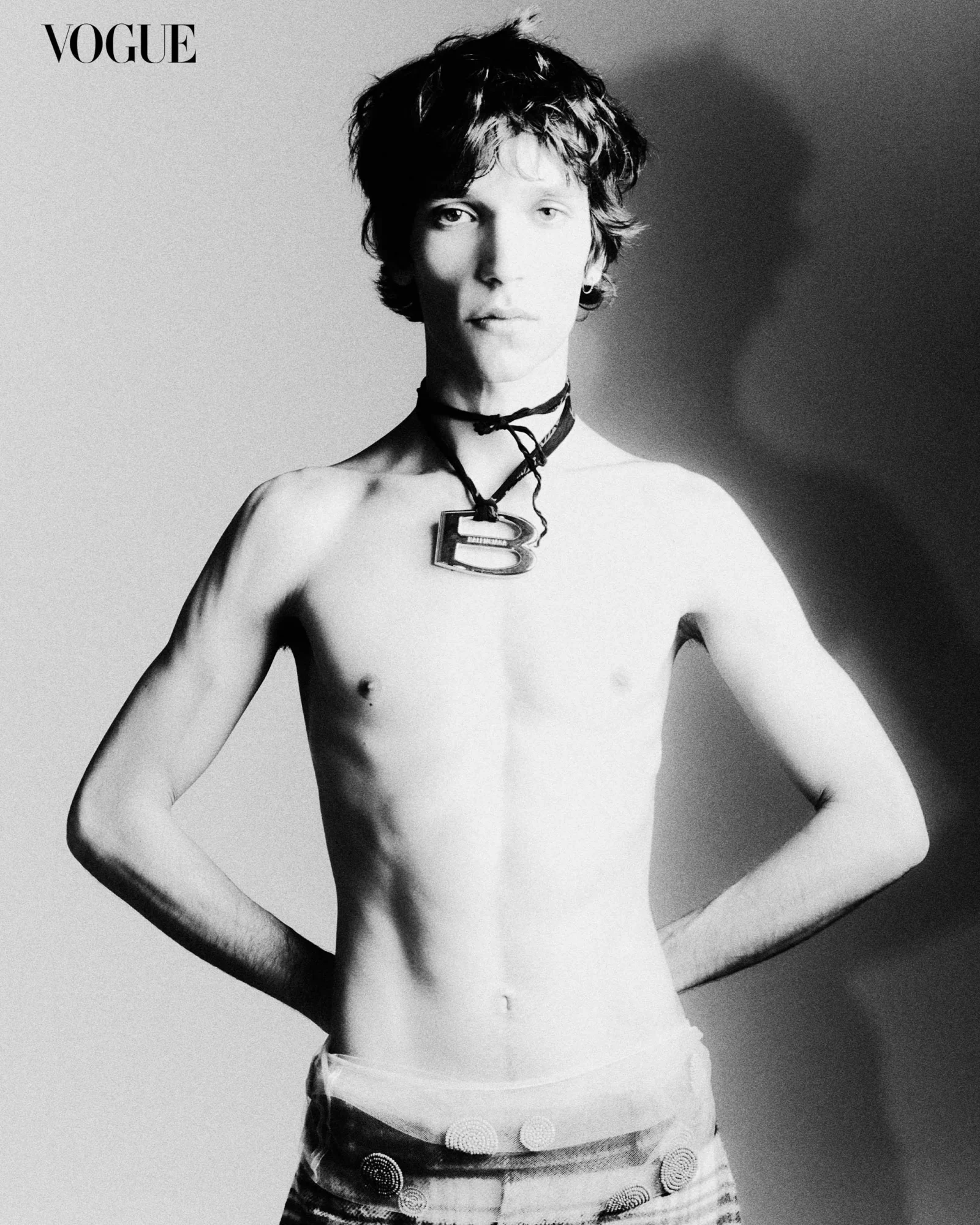 Eliseu wears a Balenciaga necklace, shorts worn over tulle skirt both Fendi