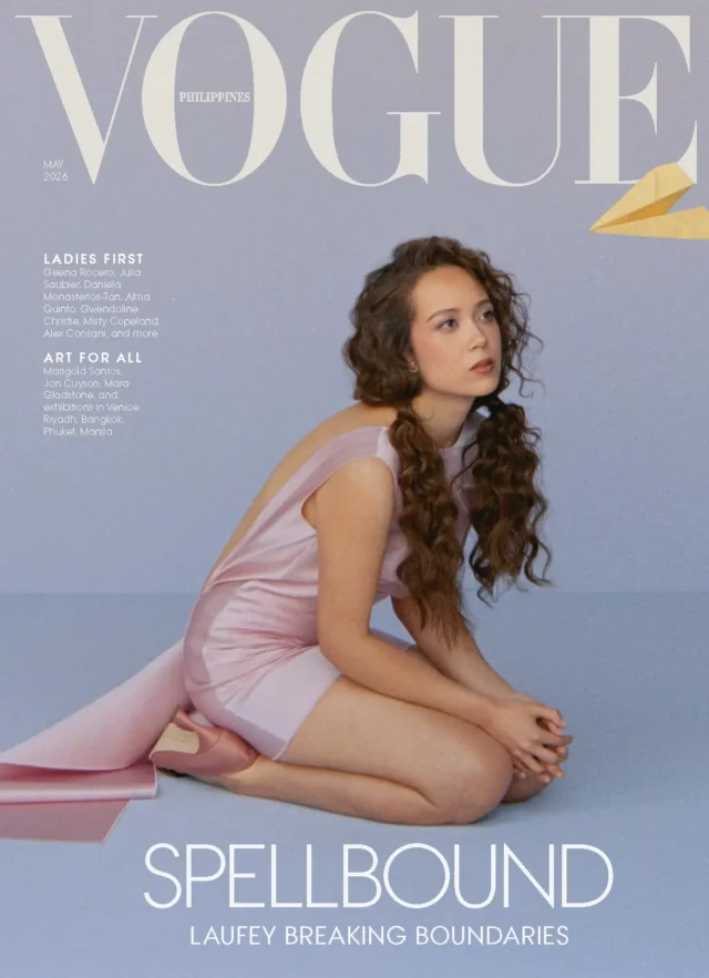 Vogue Philippines May 2026 cover: a woman in a pale pink dress sits on the floor against a lavender backdrop, with bold SPELLBOUND text at the bottom.