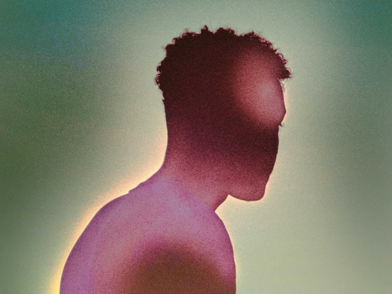 Silhouette of a shirtless man in profile with a soft backlight against a greenish gradient background.
