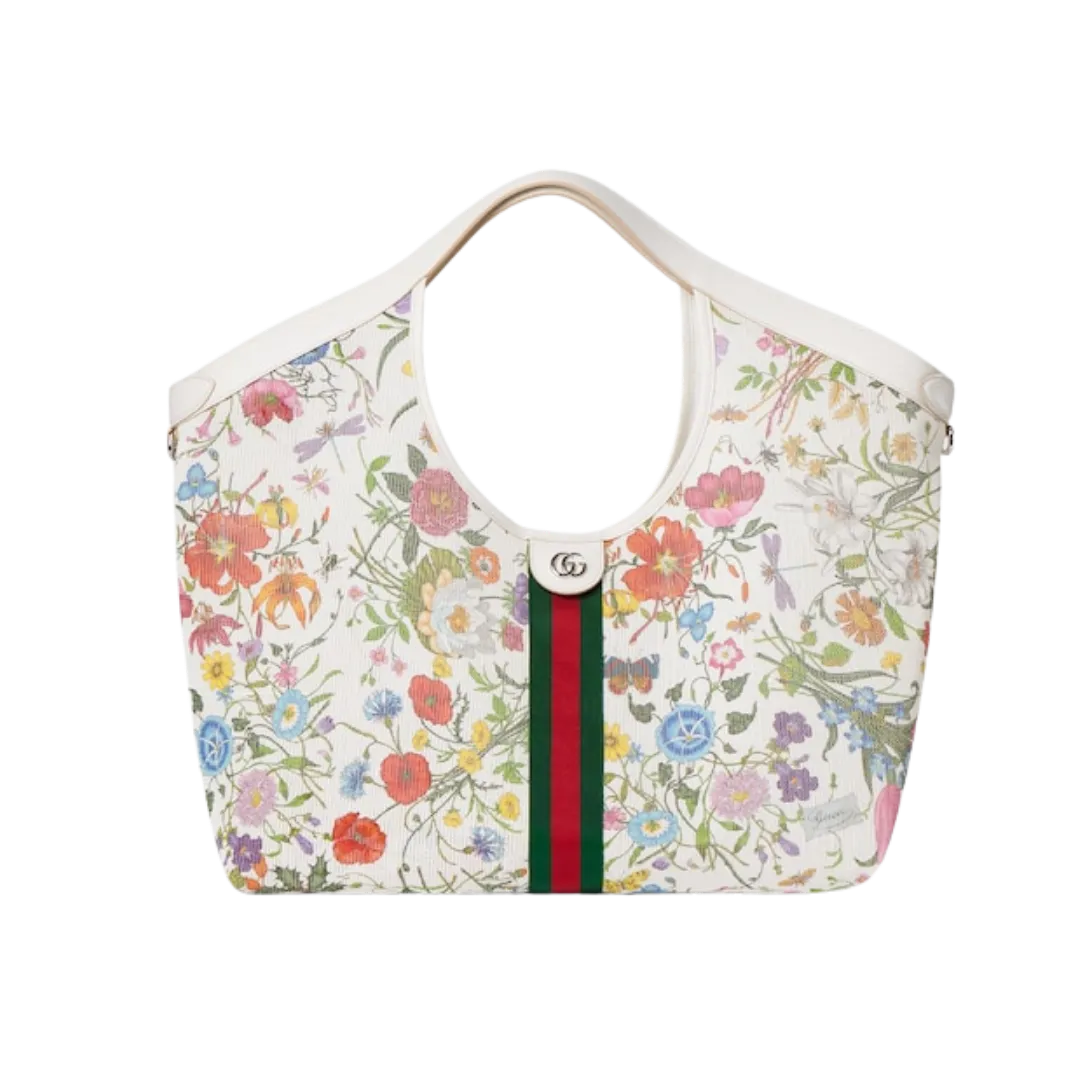 Floral tote bag with light background, beige handles, and a central green–red–green stripe with a GG clasp.