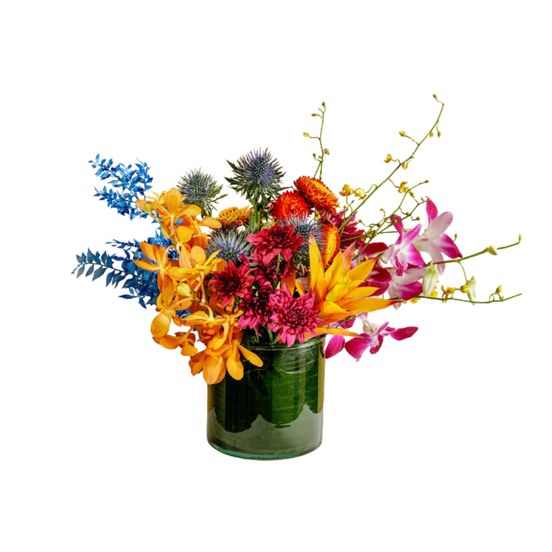 Colorful bouquet of blue, orange, pink, and red flowers in a green glass vase.