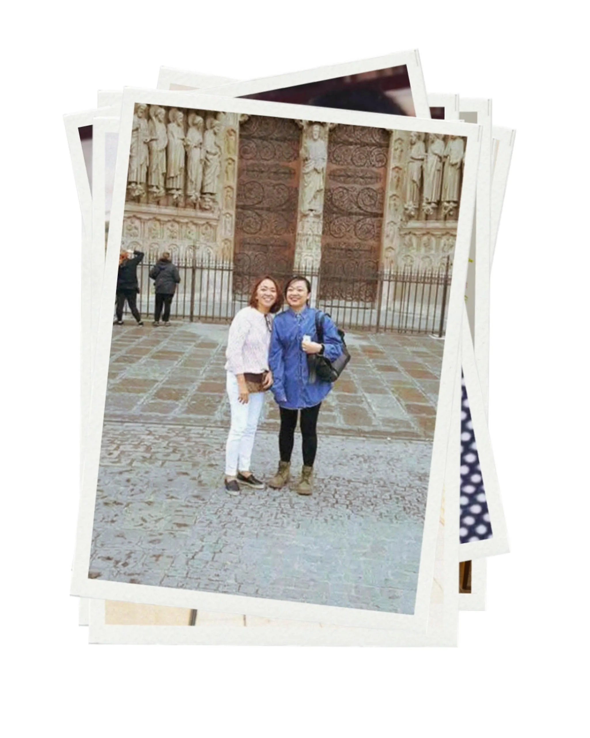 Two women smiling and posing together in front of a decorative historic gate, stacked photo frames around them