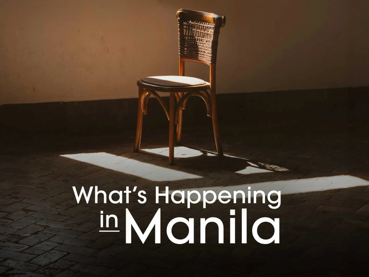 Bold white headline 'What’s Happening in Manila' over a sunlit rustic room with a wooden chair on the right side.