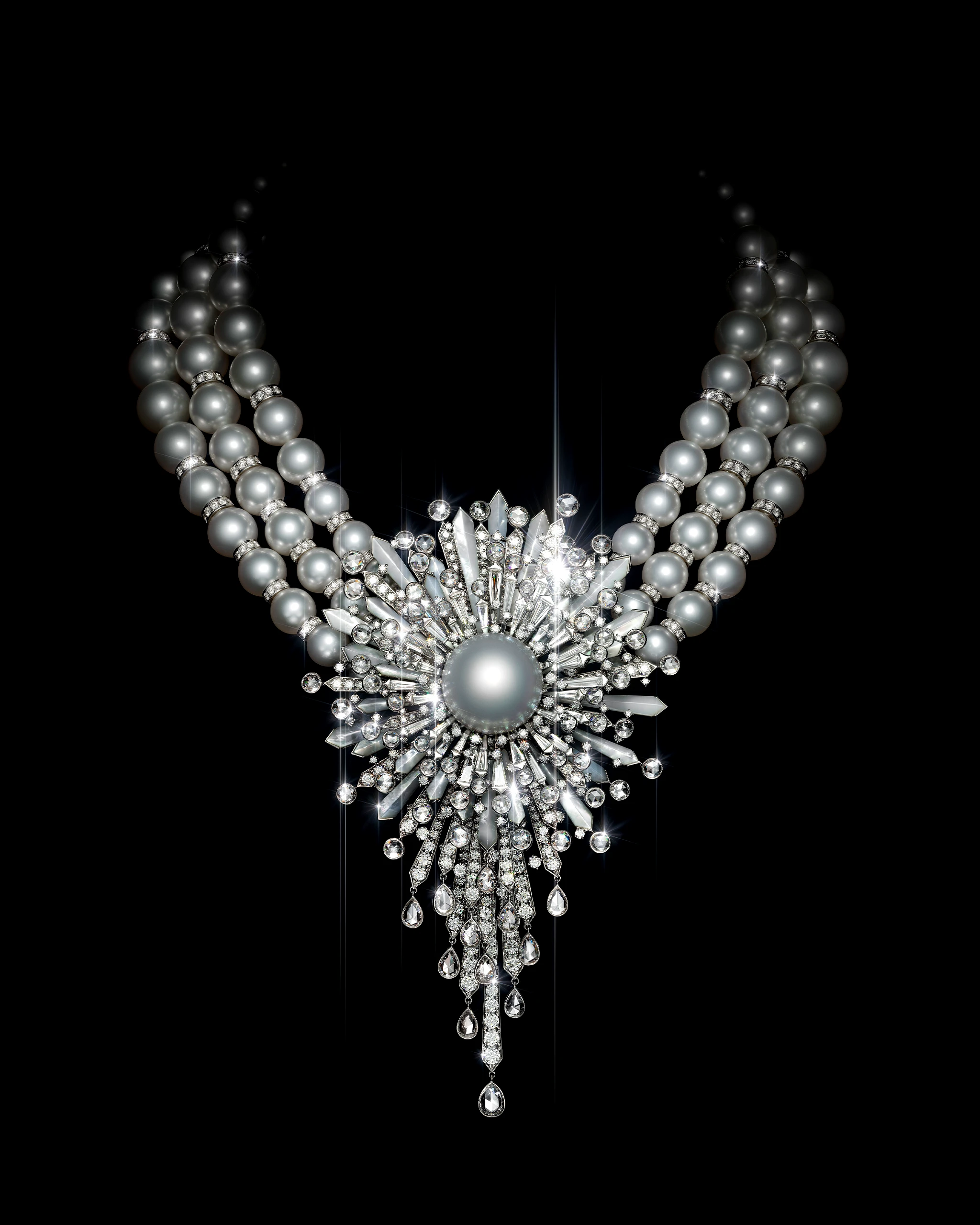 Elegant pearl and diamond necklace with a radiant central pendant on a black background.