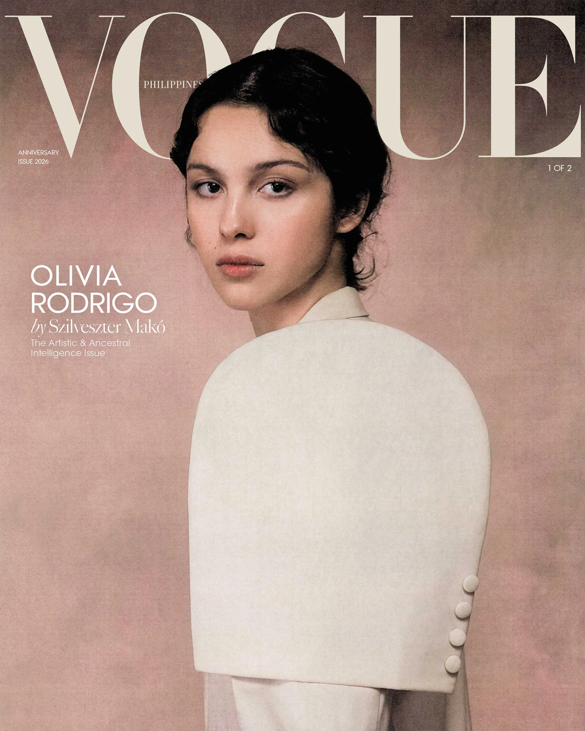 Vogue magazine cover with Olivia Rodrigo's portrait on a pink-beige background, large Vogue typography above left.