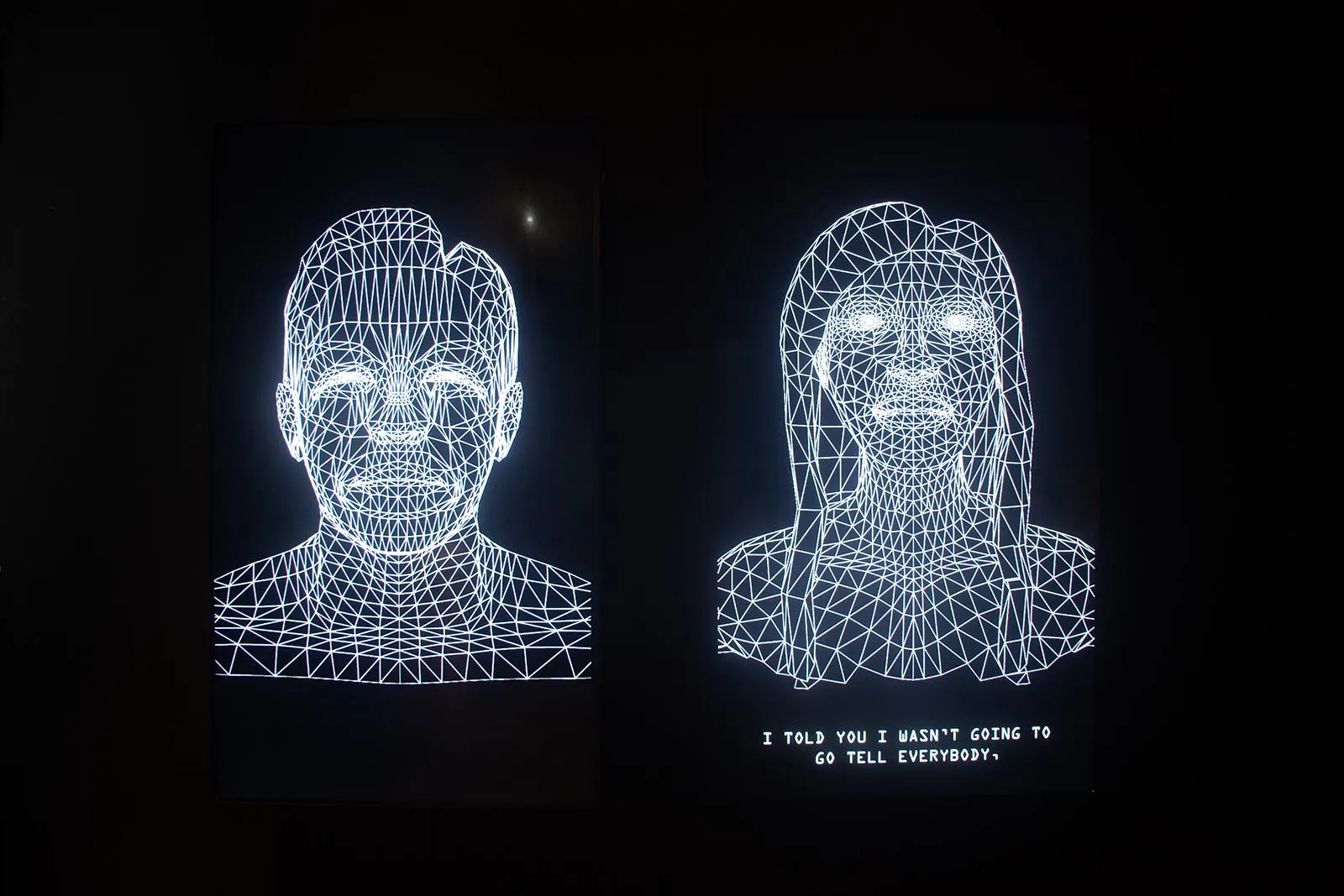 Two illuminated wireframe portraits (a man left, a woman right) formed by white geometric lines against a dark background.