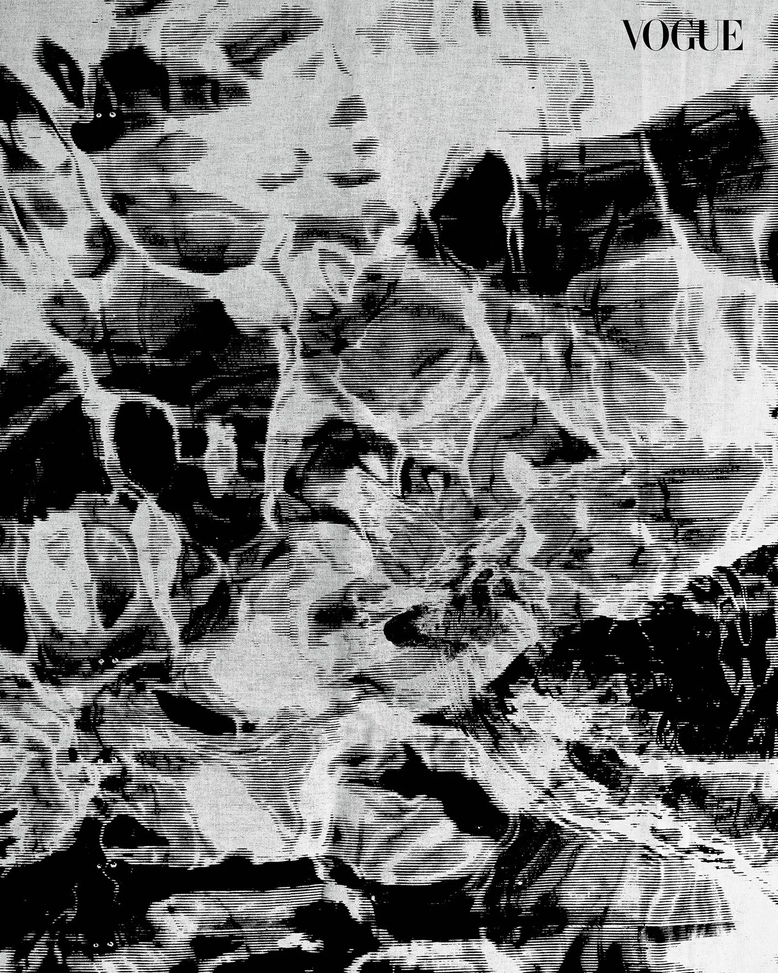 High-contrast abstract black-and-white pattern with a Vogue logo in the top-right corner.