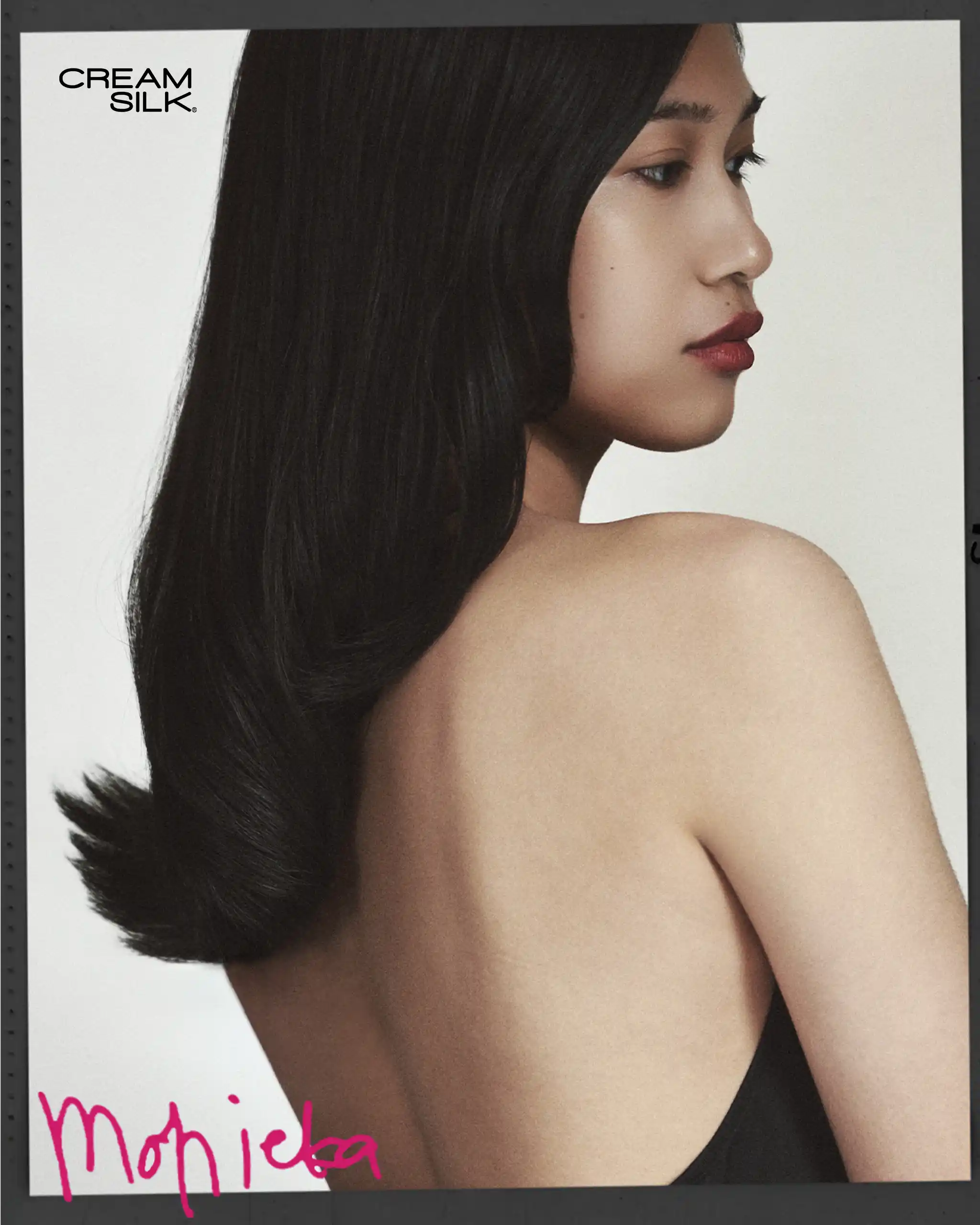 Profile view of a woman with long black hair and bare shoulders; Cream Silk logo in the top left corner.