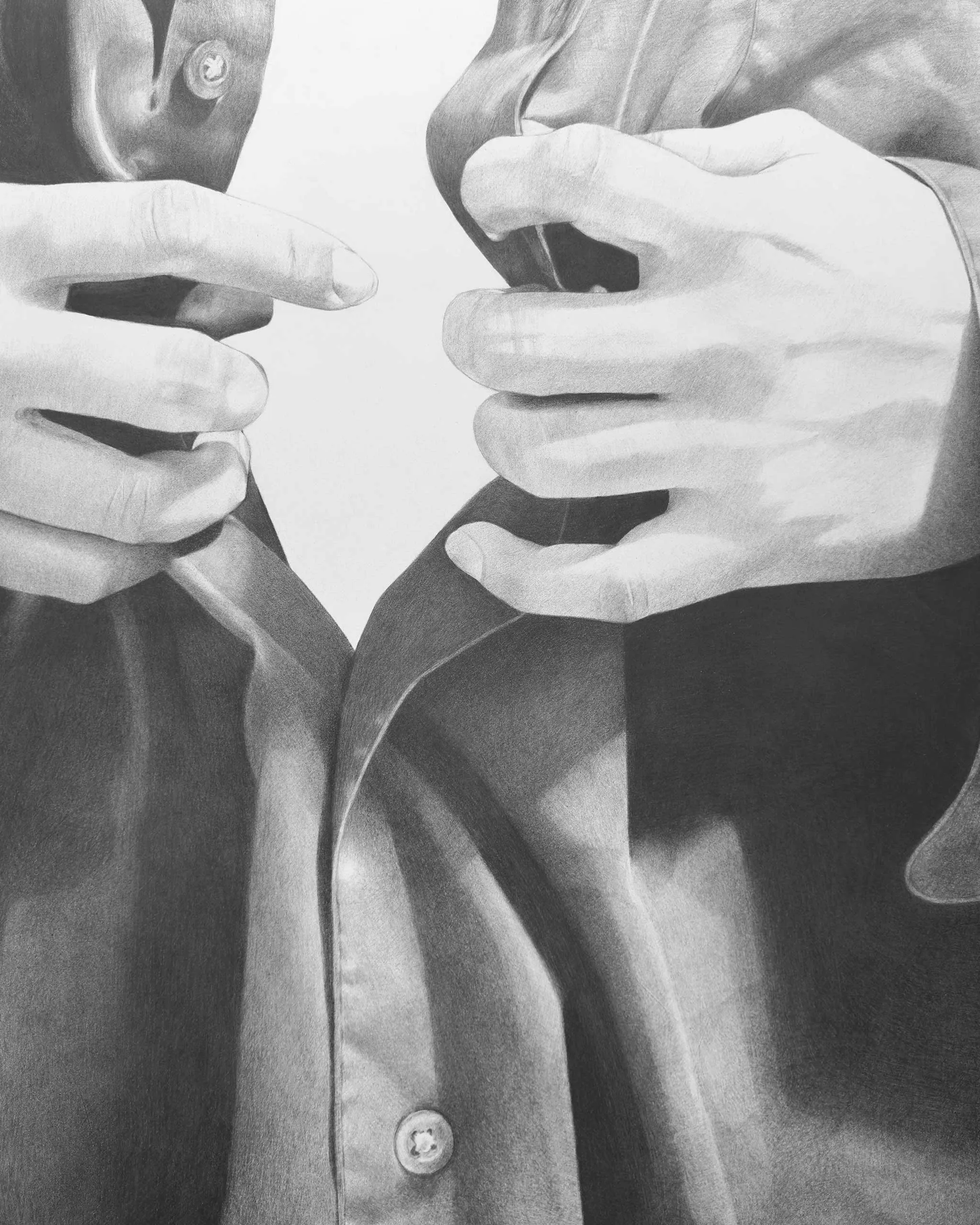 Two hands buttoning a coat, focusing on the buttons and fabric details.