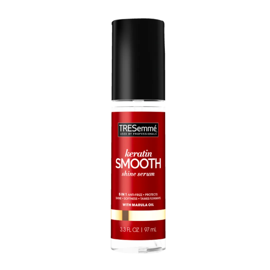 Tresemmé Keratin Smooth Shine Serum bottle with red label and black cap on a black background, 3.3 fl oz (97 ml).