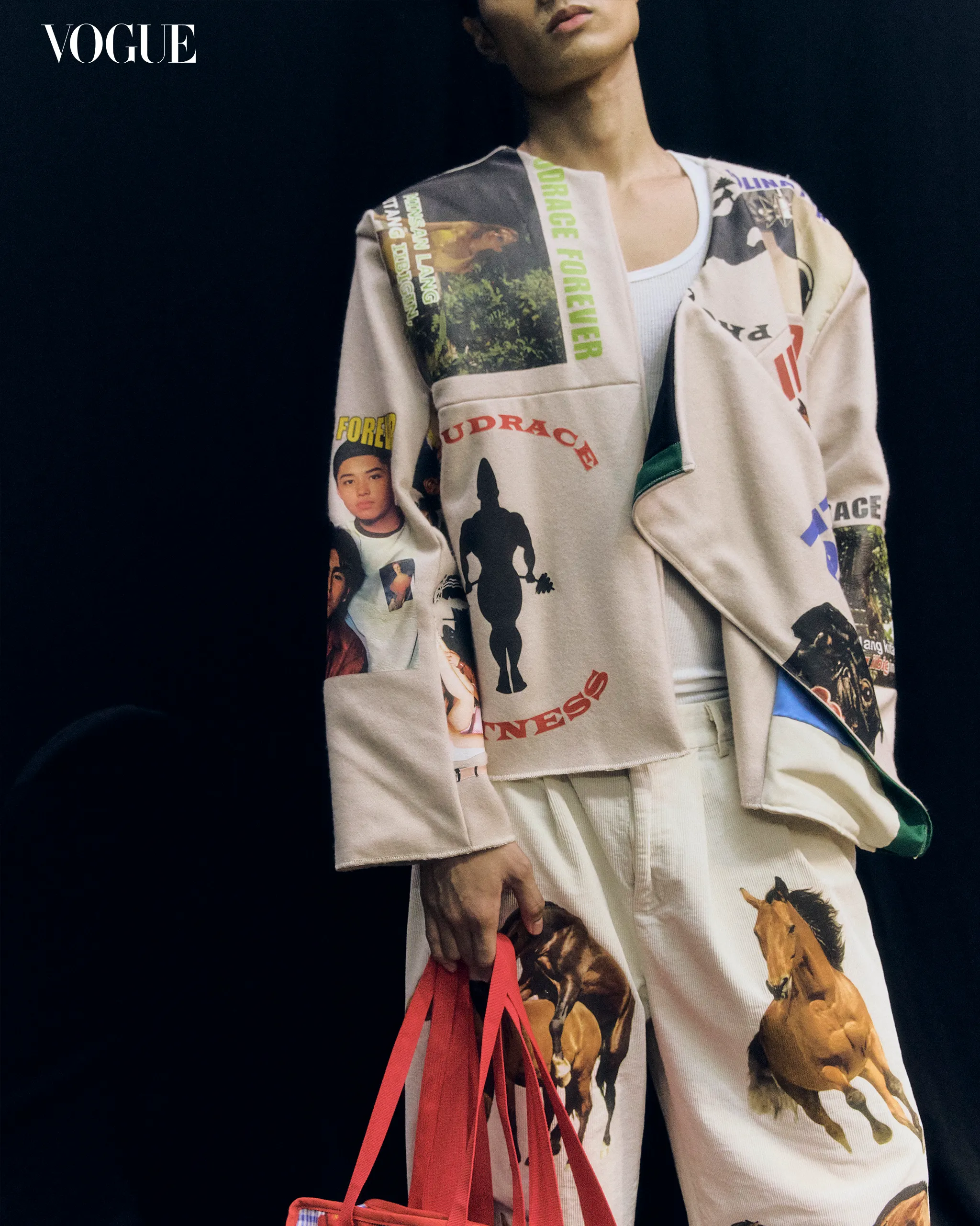 Model wearing a beige collage-print coat with graphics, holding a red bag, against a dark background; VOGUE logo in the corner.