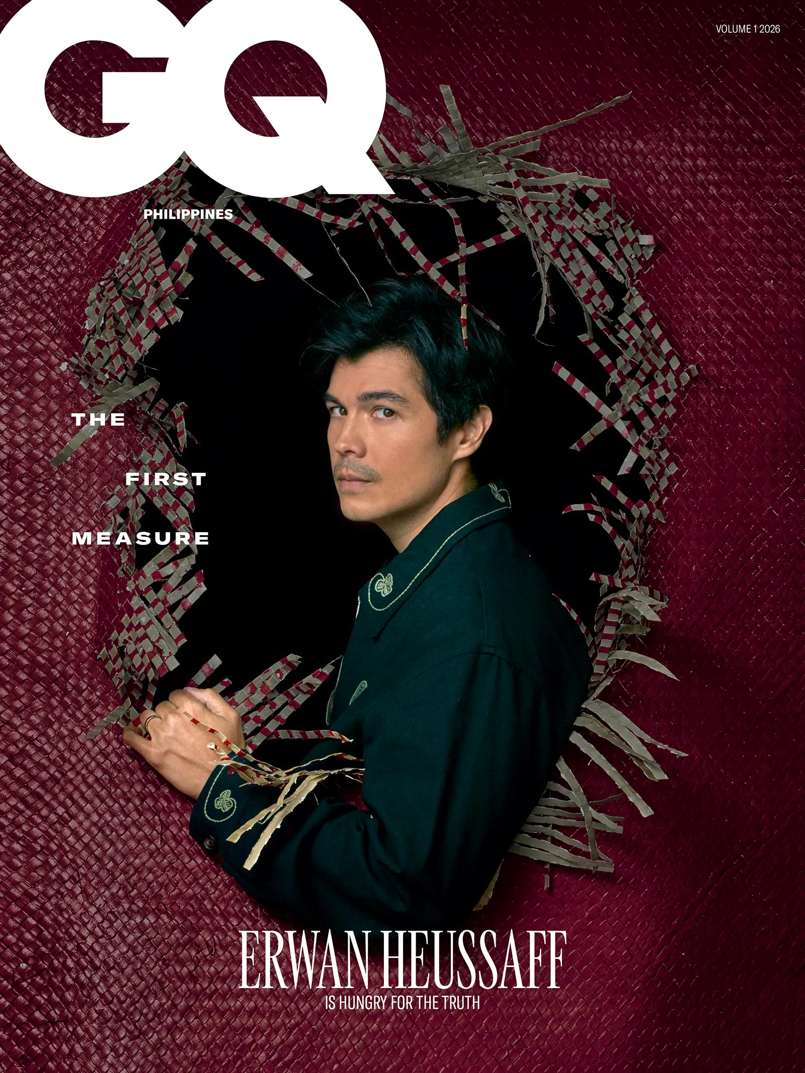 GQ Philippines magazine cover featuring Erwan Heussaff against a maroon textured backdrop with torn paper border and the caption 'THE FIRST MEASURE' (bottom) and 'IS HUNGRY FOR THE TRUTH' at the bottom edge, Volume 1 2026.