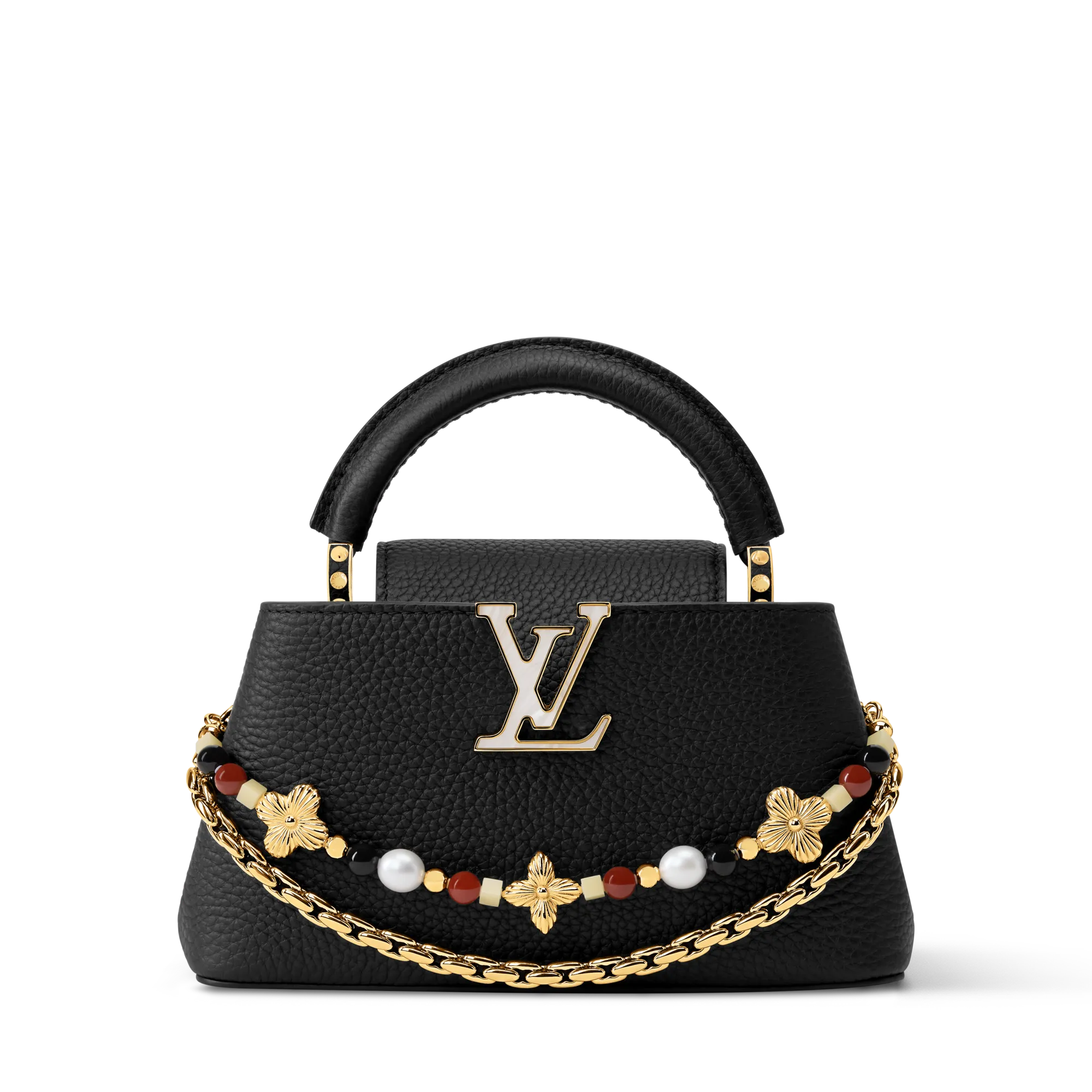 Close-up of a black textured leather handbag with gold LV logo hardware and a decorative necklace draped around it against a plain backdrop.