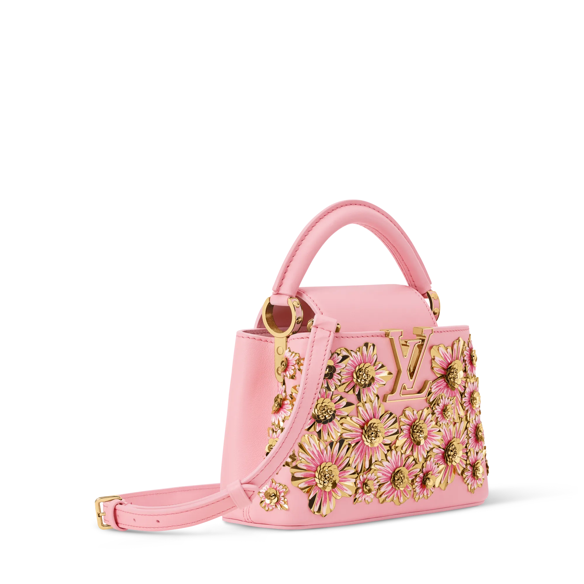 Pink handbag with gold-tone floral appliqués and hardware, shown from a partial side view.